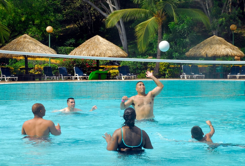 Air Force Tech. Sgt. Orlando Diaz serves the ball during a water volleyball match at the Warrior Health and Healing retreat near Montelimar, Nicaragua, April 25. Thirty-seven recently-returned OPERATION IRAQI FREEDOM and OPERATION ENDURING FREEDOM veterans attended the retreat to share experiences and attend classes on reintegration topics. (U.S. Air Force photo/Tech. Sgt. Mike Hammond)