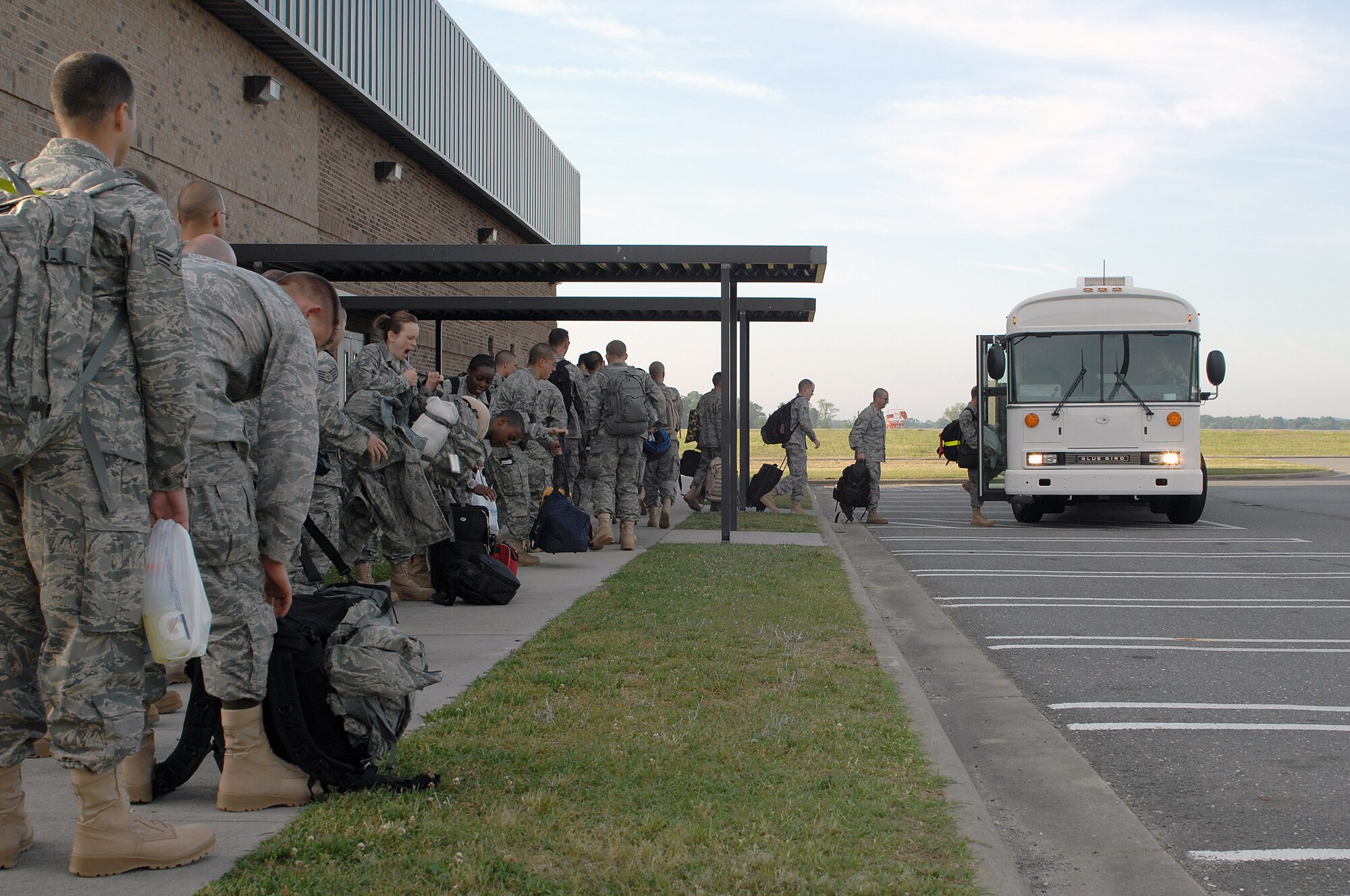 Airmen from the 4th Fighter Wing board a bus that will take them to a waiting aircraft April 29 at Seymour Johnson Air Force Base, N.C. More than 300 personnel deployed for a four-month rotation in support of Operation Enduring Freedom. (U.S. Air Force photo/2nd Lt. Matthew D. Schroff) 