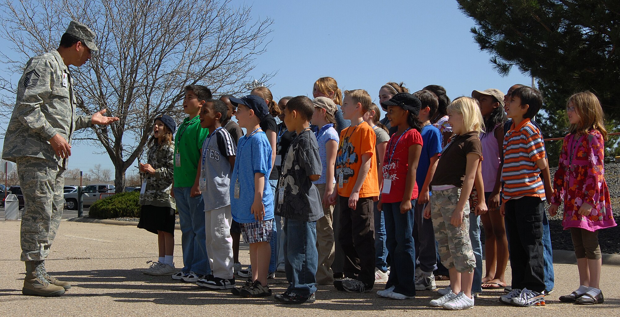 Senior Master Sgt. Ramon Roldan, DPP, teaches children about military courtesies during the Bring Your Child to Work Day event at ARPC on April 29. More than 30 children and their parents or grandparents participated in the day. (U.S. Air Force photo/Greg Simmonds)
