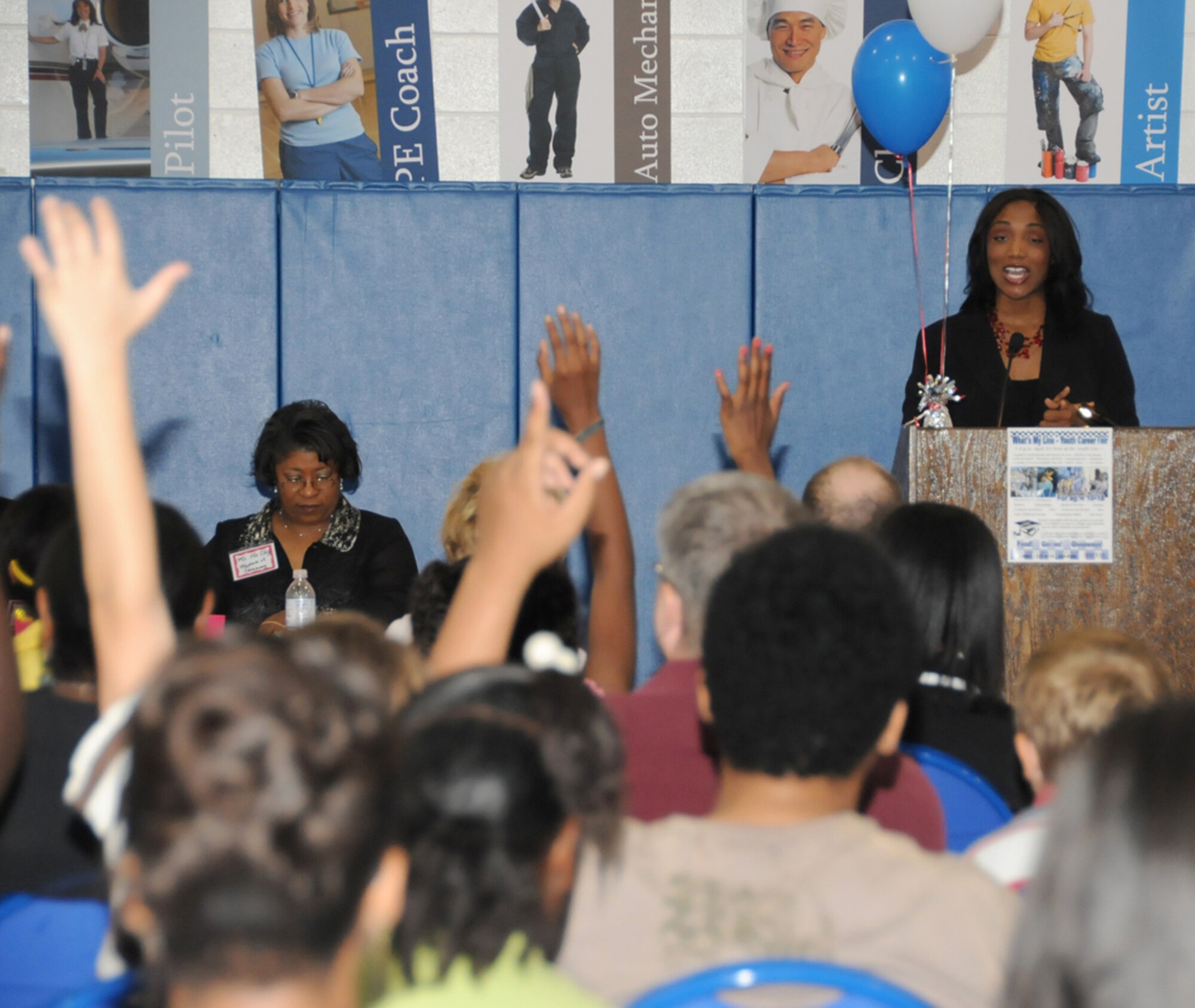 Krystal Allen, weekend new anchor and field reporter at WLOX-TV answers questions from young people attending Saturday’s youth center’s career fair.  Professionals from many career fields manned booths and spoke to those who attended about job opportunities in today’s workplace.  (U.S. Air Force photo by Kemberly Groue)
