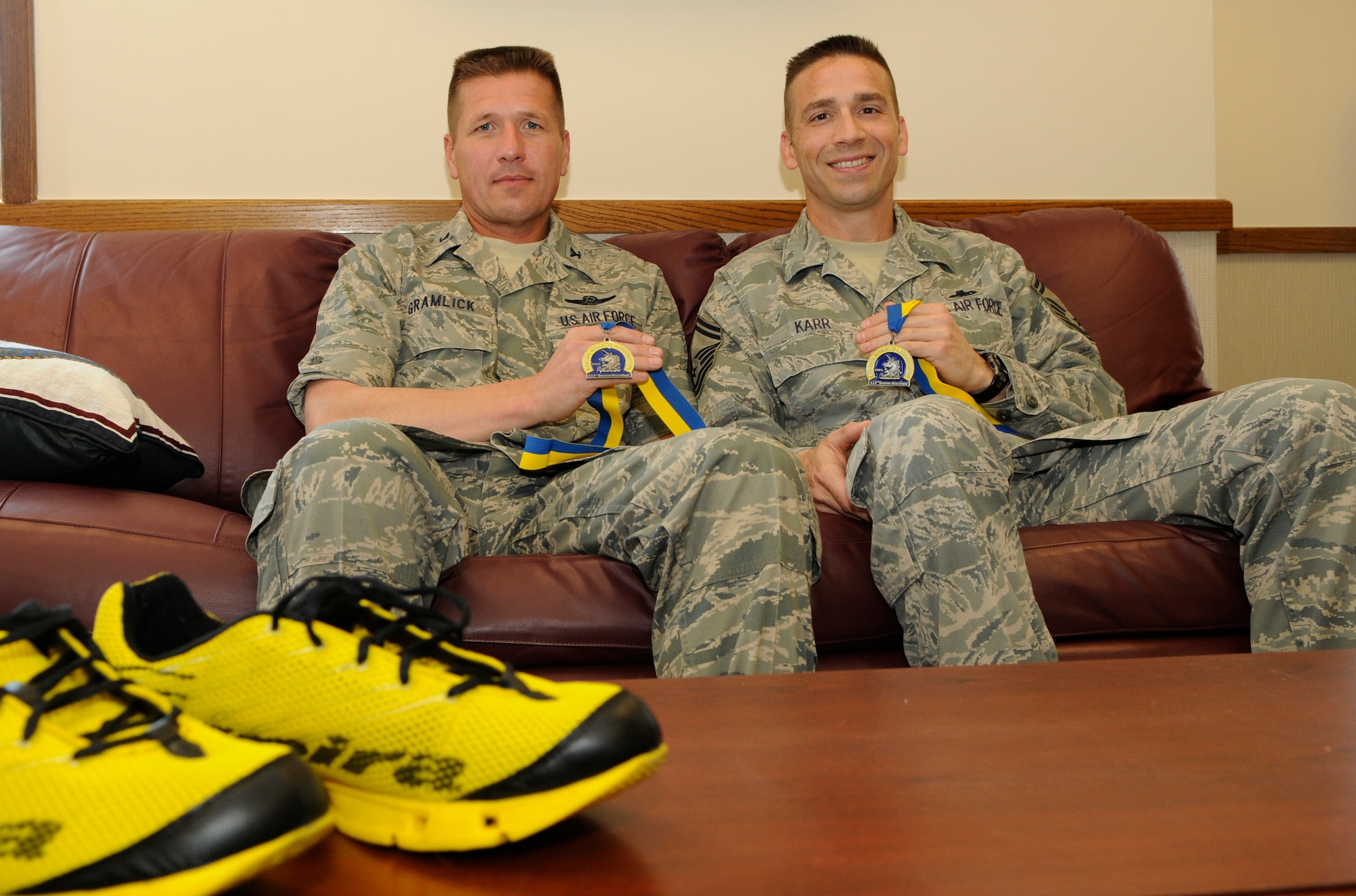 Col. Carl Gramlick, 11th Wing vice commander, and Senior Master Sgt. Andre Karr, 11th Comptrollers Squadron superintendent, show medals April 24 that they received from running the Boston Marathon. Over 23,000 participants ran the marathon and over 500,000 spectators watched it in person. (U.S. Air Force photo by Senior Airman Tim Chacon) 