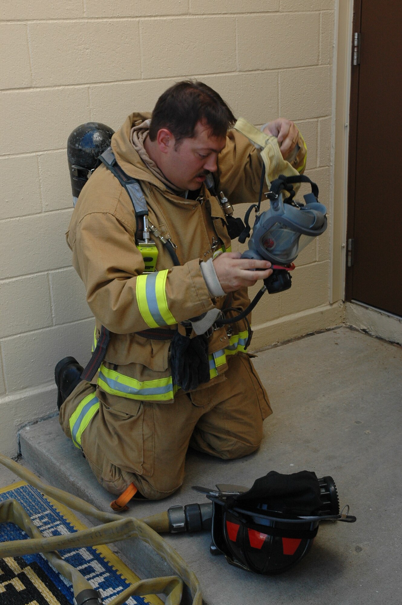 Captain Todd Lambert of the Tinker Fire Department is preparing to enter a training scenario. The fire department recently used a rapid process improvement project to increase safety for firefighters while decreasing the amount of time it takes them to respond to a fire in a large industrial facility. Tinker’s largest facility, Bldg. 3001, is nearly a mile long