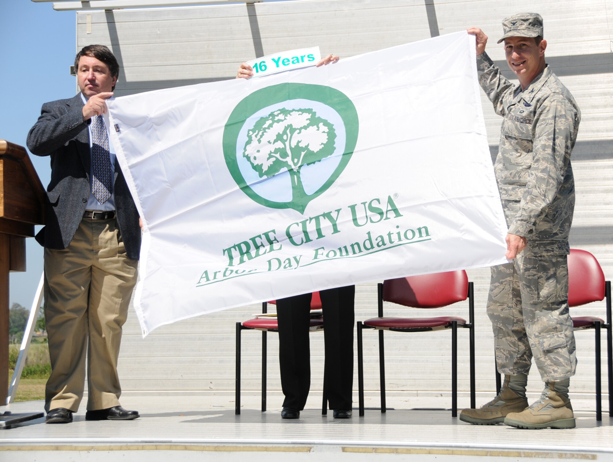 Rick Olson, left, Mississippi Forestry Commission, presents Col. Christopher Valle, 81st Training Wing commander, a Tree City USA flag.  It’s the 16th consecutive year that Keesler has earned the honor.  (U.S. Air Force photo by Kemberly Groue)