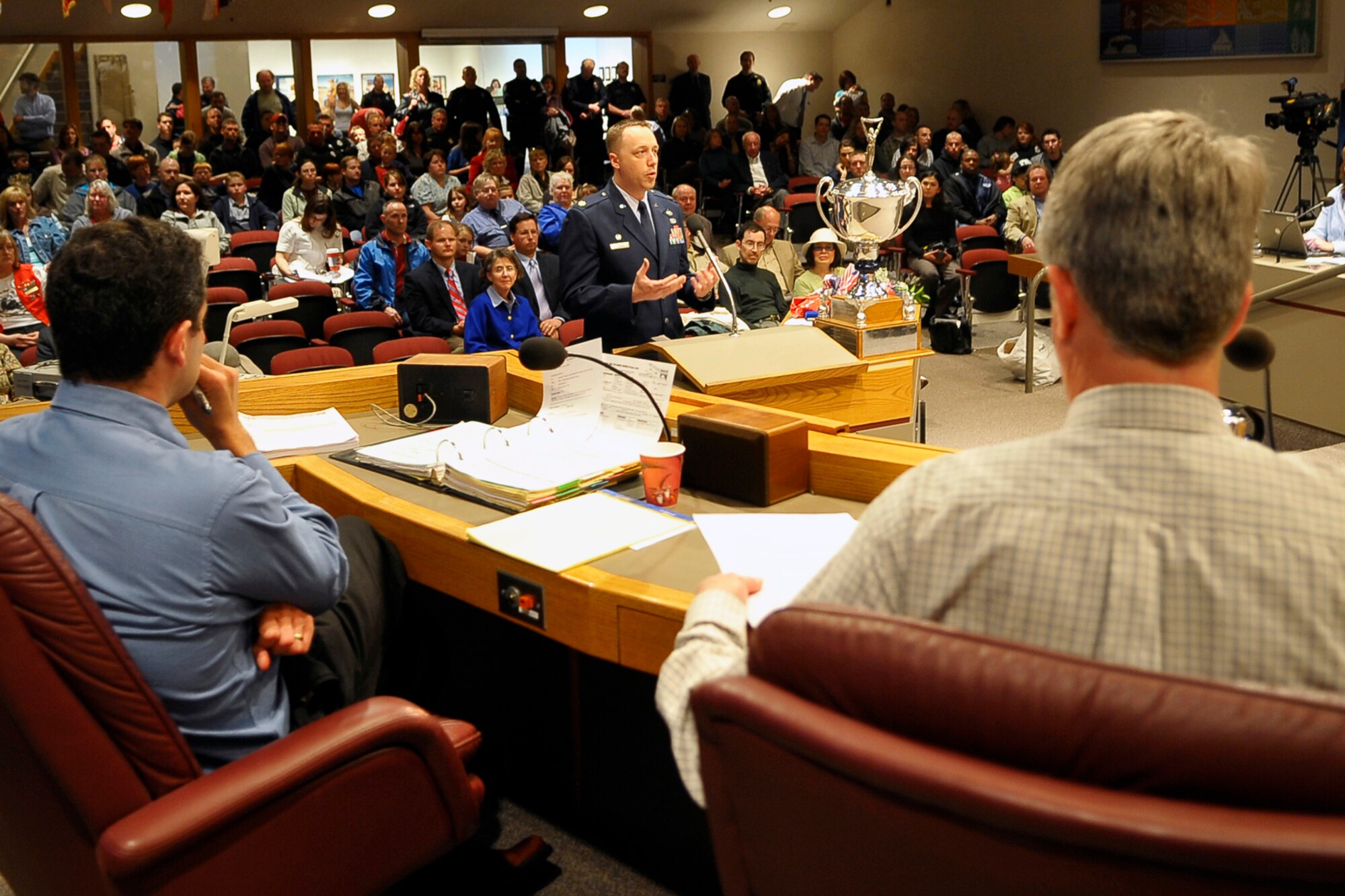 SPOKANE, Wash. – Maj. Breck Woodard, 92nd Logistics Readiness Squadron commander, speaks before the Spokane City Council after accepting the Neal Fosseen Award on behalf of his unit, at the City Council building April 27. The 92nd LRS won the award for their outstanding volunteer contributions in the Spokane area. (U.S. Air Force photo / Senior Airman Joshua K. Chapman)