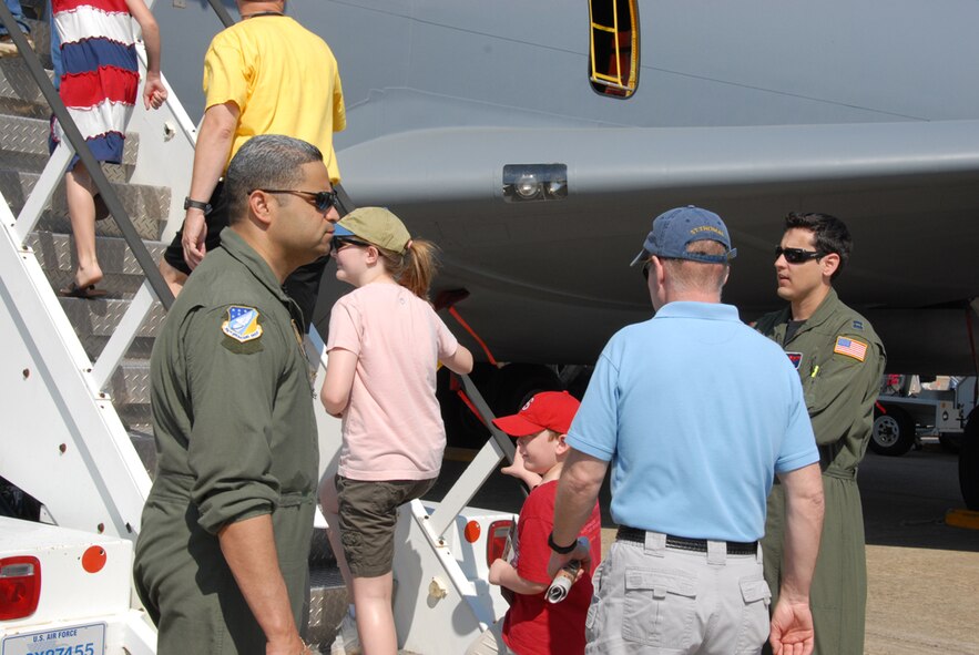 SEYMOUR JOHNSON AIR FORCE BASE, N.C. -- Members of the 916th Air Refueling Wing talk to air show visitors during the 2009 Wings Over Wayne air show. A KC-135R Stratotanker from the Air Force Reserve wing was on static display for the two-day show.
