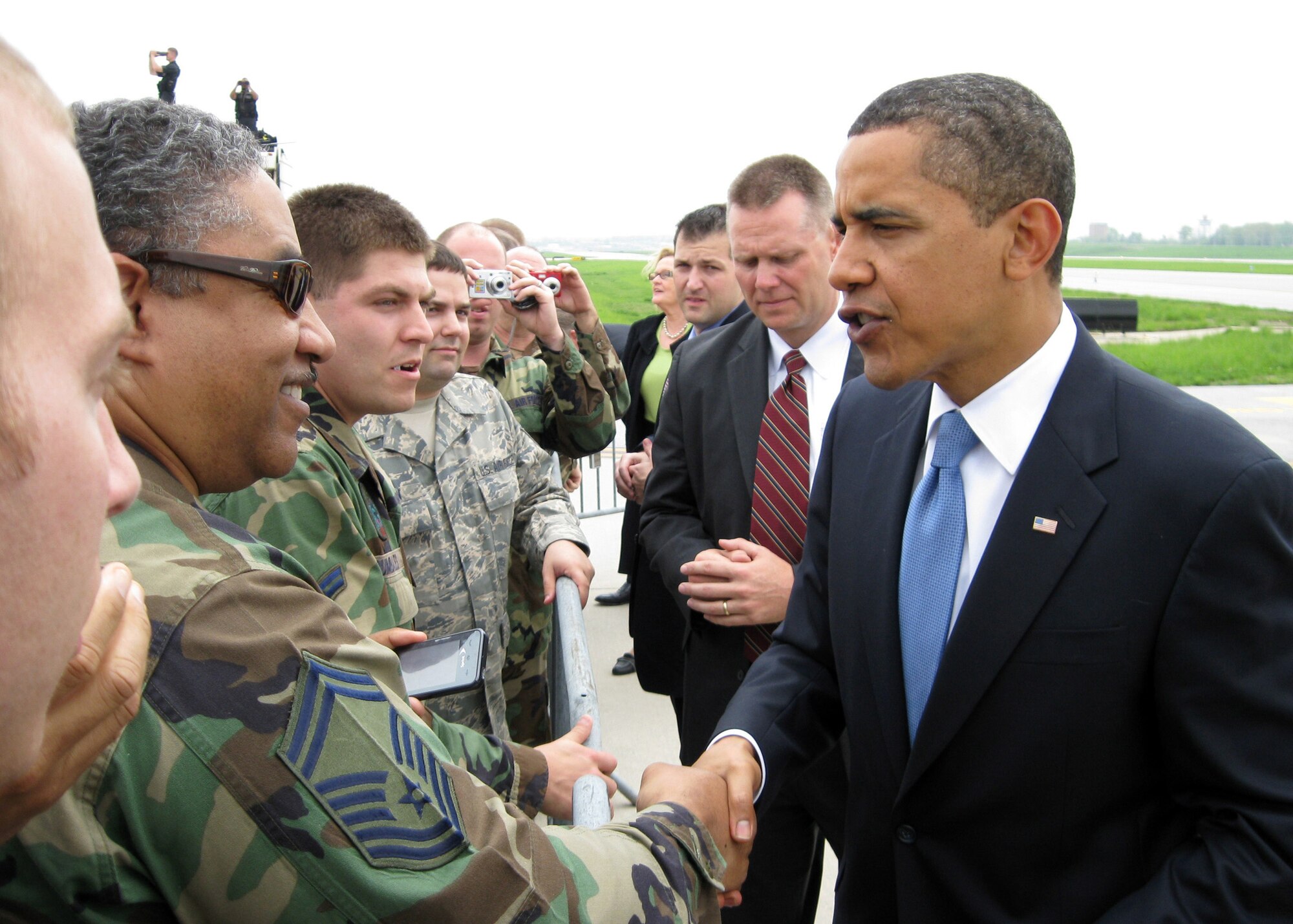President Barack Obama greets a member of the 131st Fighter Wing, Missouri Air National Guard, at Lambert-Saint Louis International Airport prior to his departure on Air Force One on April 29.  President Obama marked his 100th day in office with a Town Hall Meeting in Arnold, a surburb of Saint Louis, earlier that day. (U.S. Air Force Photo by Lorenzo "Skip" Doyle)  (RELEASED)