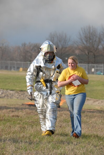 Members of the 180th Fighter Wing fire department participated in an aircraft crash and recovery exercise at the Toledo Express Airport on April 22. The drill, required every three years, not only tests the response of airport authorities, but also the response of other local emergency, fire and rescue crews that would normally respond to such an incident, to include the 180th FW fire department.  (Air Force photo taken by SrA Jodi Leininger, released by TSgt Beth Holliker.)