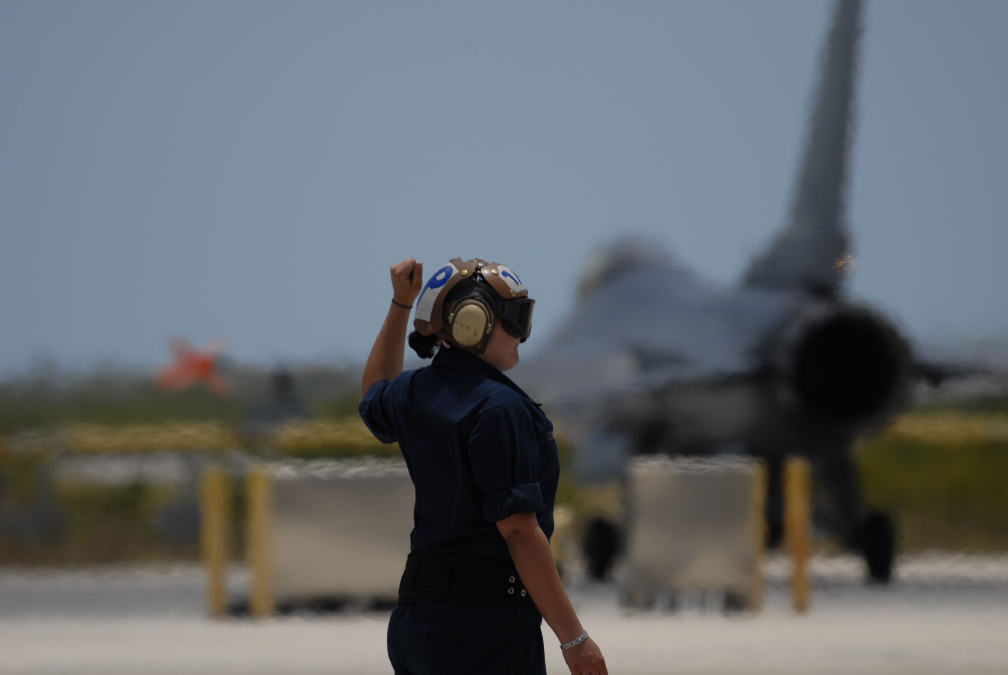 Seaman Samantha Lynch, an aviation machinist's mate with Strike Fighter Squadron 2, Naval Air Station Lemoore, Calif., worked alongside her Air Force counterparts from the Wisconsin Air National Guard's 115th Fighter Wing in Madison, during a two-week air-to-air combat skills training mission at NAS Key West, Fla.  As part of the exercise, the aircraft maintainers participated in a swap program that had Air Guard maintainers helping to launch FA-18F Super Hornets and Navy maintainers doing the same with F-16C Fighting Falcons. (U.S. Air Force photo/Master Sgt. Dan Richardson)