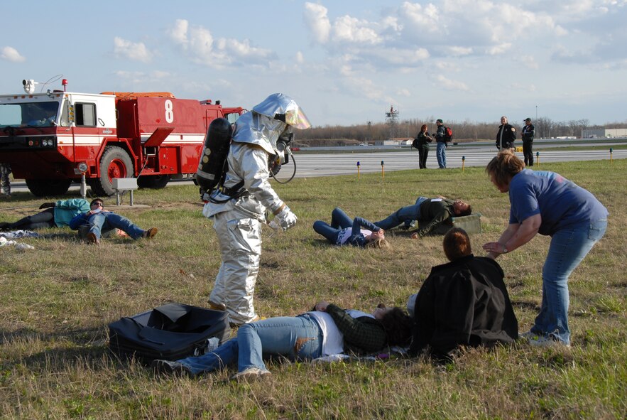 Members of the 180th Fighter Wing fire department participated in an aircraft crash and recovery exercise at the Toledo Express Airport on April 22. The drill, required every three years, not only tests the response of airport authorities, but also the response of other local emergency, fire and rescue crews that would normally respond to such an incident, to include the 180th FW fire department.  (Air Force photo taken by SrA Jodi Leininger, released by TSgt Beth Holliker.)