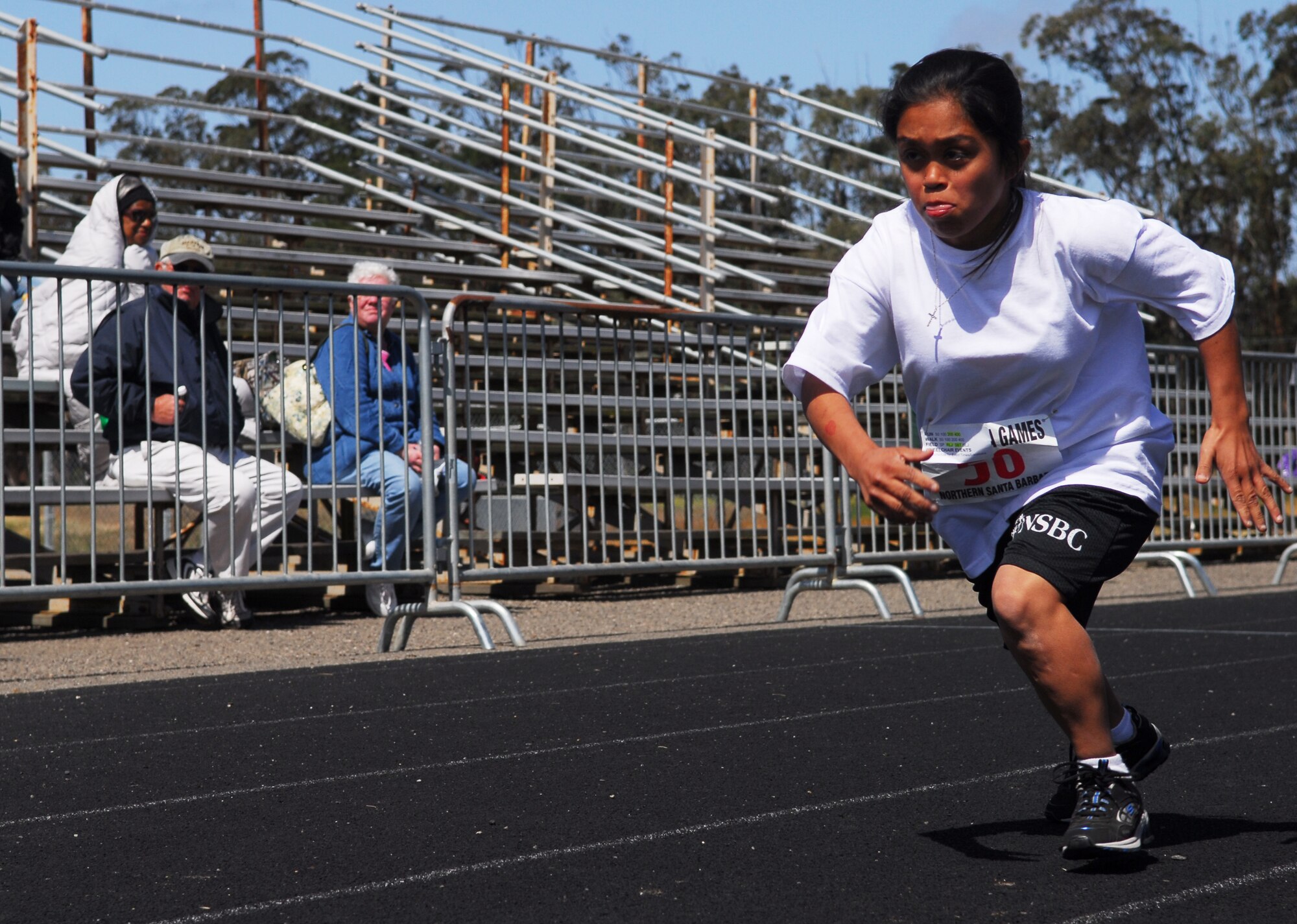 VANDENBERG AIR FORCE BASE, Calif. -- Monique Ontiveros, a Special Olympian from Santa Barbara County, sprints during a 200-meter dash at the base track here April 25. Airmen from Vandenberg helped set up the event and escorted the competitors throughout the day. (U.S. Air Force photo / Senior Airman Christopher Hubenthal)