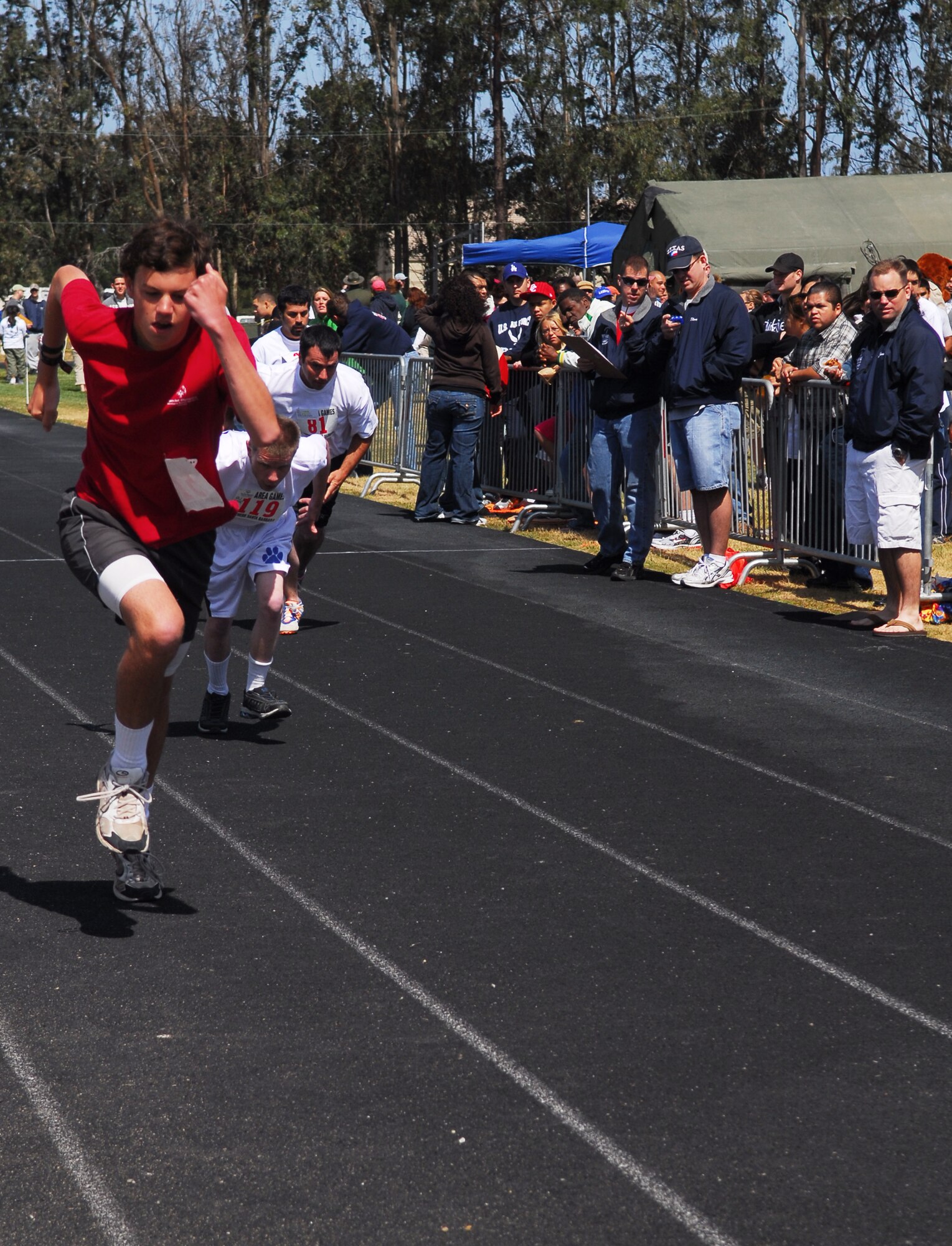 VANDENBERG AIR FORCE BASE, Calif. -- Matthew Pearson, a Special Olympian from Santa Barbara, sprints toward the finish line at the base track here April 25. Vandenberg Airmen and civilians volunteered their time and effort to make the event possible. (U.S. Air Force photo / Senior Airman Christopher Hubenthal)