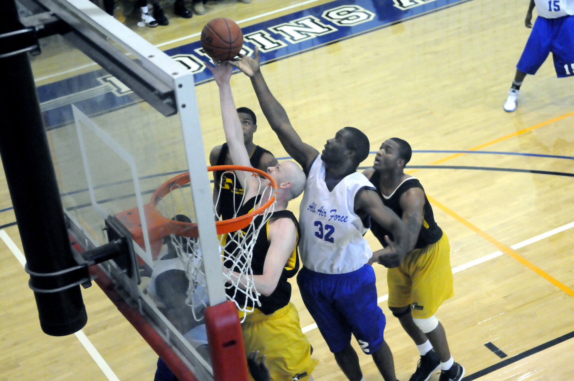 Staff Sgt. Miguel Stewart, from Robins,goes up for a rebound at the basket against an All-Army opponent during an exhibition game between the All-Air Force and the All-Army men's basketball teams.  U.S. Air Force phot by Sue Sapp.