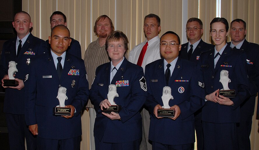 The winners of the 71st Flying Training Wing Quarterly Awards were announced at a luncheon held April 23 at the Vance Collocated Club. They are, front row, left to right: NCO of the Quarter, Staff Sgt. Juventino Salazar, 71st Security Forces Squadron; Senior NCO of the Quarter, Master Sgt. Lisa Finuff, 71st Medical Support Squadron; Honor Guard of the Quarter, Senior Airman Christopher Francisco, 71st Medical Operations Squadron; and Volunteer of the Quarter, 1st Lt. Agneta Murnan, 71st FTW Public Affairs. Second row, left to right: Airman of the Quarter, Senior Airman Damien Foord, 71st SFS; Company Grade Officer of the Quarter, Capt. Christopher York, 71st Operations Support Squadron; Category I Civilian of the Quarter, Eugene Kampe, 71st MDSS; Category II Civilian of the Quarter, David Harris, 71st SFS; Quality Assurance Personnel of the Quarter, Master Sgt. Markus Schnellhammer, 71st FTW Maintenance Quality Assurance; and Instructor Pilot of the Quarter, Capt. Phillip O'Briant, 3rd Fighter Training Squadron. (U.S. Air Force photo/Angie Roche)