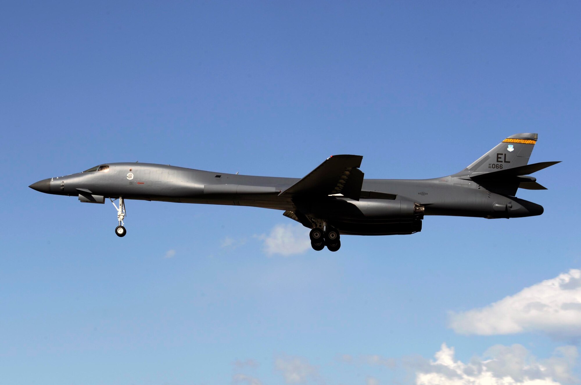 A B-1B Lancer assigned to the 37th Bomb Squadron lands here, April 29, for the first time since a 2005 mishap at Andersen Air Force Base, Guam. This B-1 received more than 15,000 hours in repairs from the 565th Aircraft Maintenace Squadron of Tinker Air Force Base, Okla., and the 28th Maintenance Group of Ellsworth. (U.S. Air Force photo by Airman 1st Class Corey Hook)