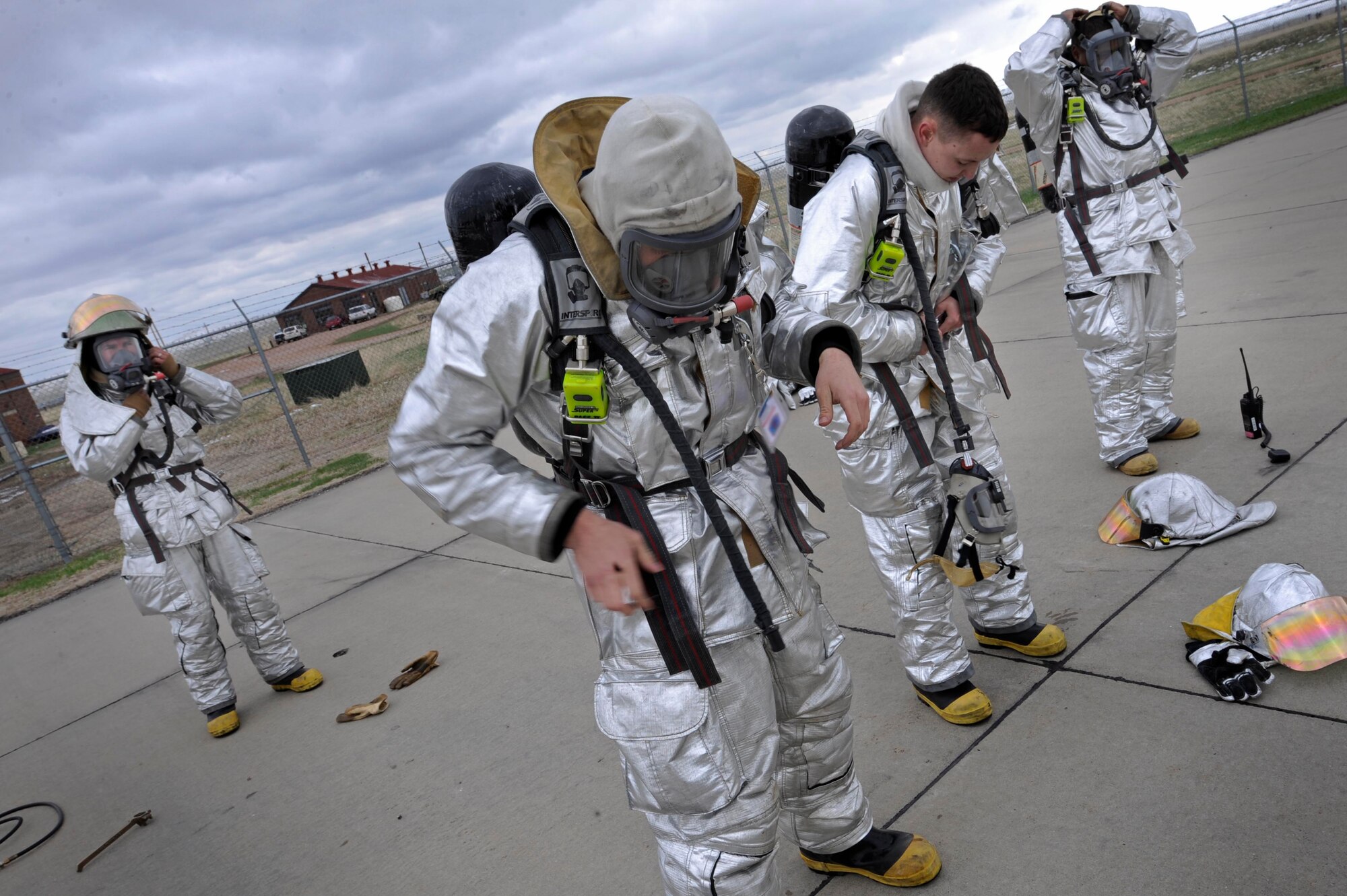 Firefighters of the 28th Civil Engineer Squadron suit up to assist in pitfire training for Aberdeen volunteer firefighters here, April 27. Aberdeen firefighters train with 28th Civil Engineer Squadron firefighters to recieve proper certification. (U.S. Air Force photo by Airman First Class Corey Hook)
