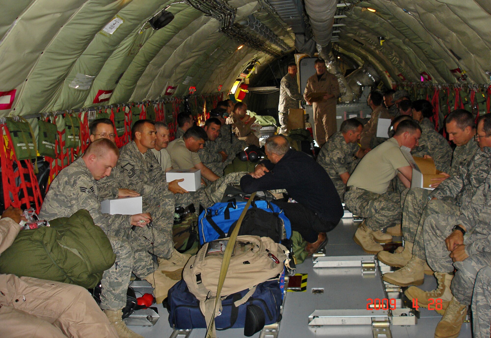 Airmen from the 931st Air Refueling Squadron wait inside a KC-135 Stratotanker Tuesday for the beginning flight of a deployment to Southwest Asia. Members of the 931st Aircraft Maintenance Squadron and the 18th Air Refueling Squadron (the flying unit of the 931st) are scheduled to support overseas contingency operations through the summer. More Airmen from the 931st ARG, an Air Force Reserve unit at McConnell Air Force Base, Kan., are scheduled to deploy in July. (Courtesy photo/Master Sgt. Tonya Halenka)