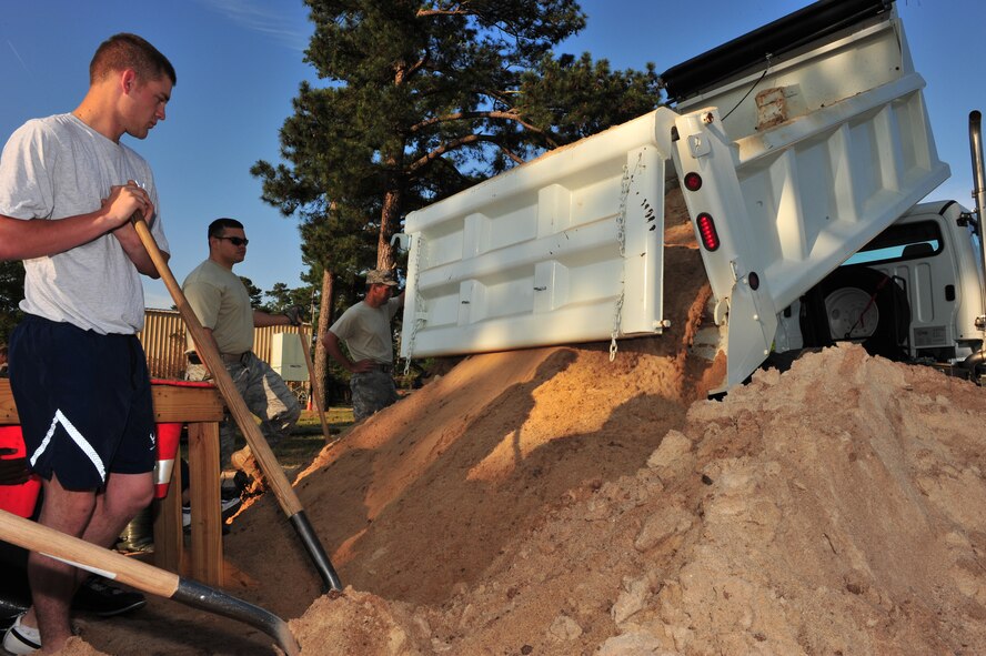 Shaw Air Force Base, S.C.- Members of Shaw AFB shovels mounds of dirt from a dump truck to make sandbags,  April 30, 2009.  The sandbags will be used in the upcoming ORE/ORI, supporting needs such as simulated bunkers and weights for shelters and contamination covers.  (U.S. Air Force Photo by Senior Airman William Coleman)