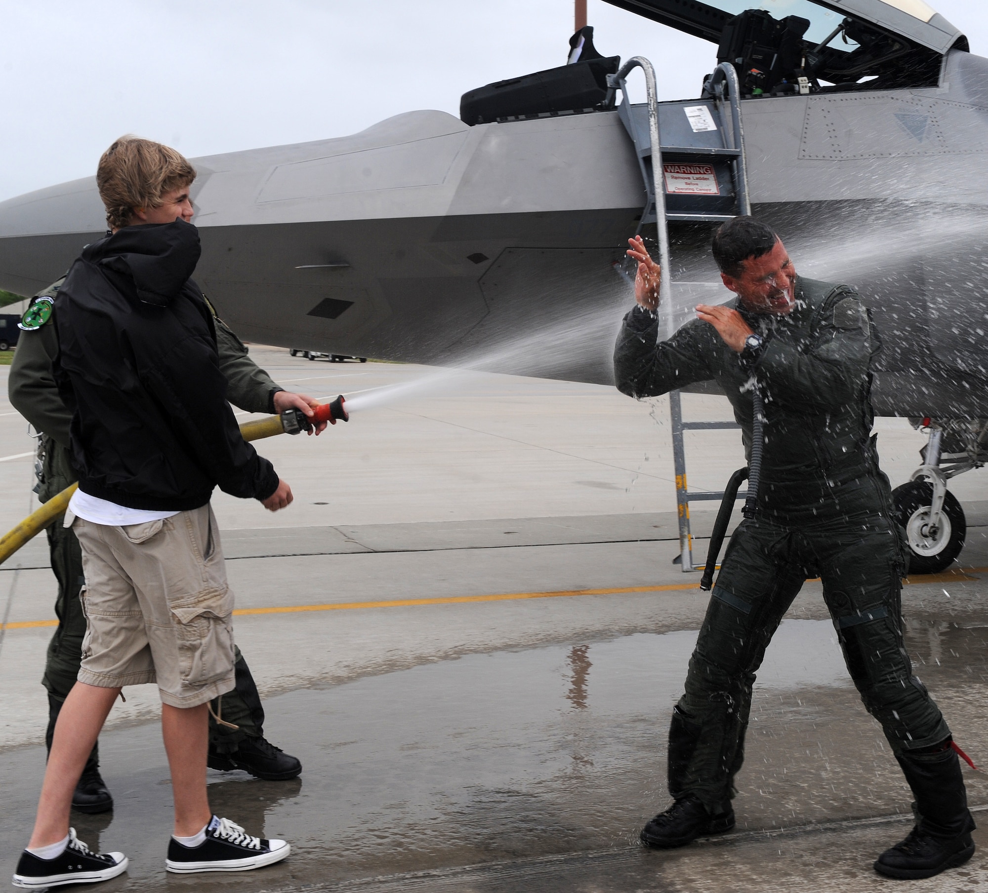 LANGLEY AIR FORCE BASE, Va. -- Col. Jeffrey W. Prichard, 1st Fighter Wing vice commander, is hosed down during his final flight April 29.  This was Colonel Prichard's final flight as vice commander of the 1st Fighter Wing before deploying to Iraq.  (U.S. Air Fore photo/Airman 1st Class Zachary Wolf)

