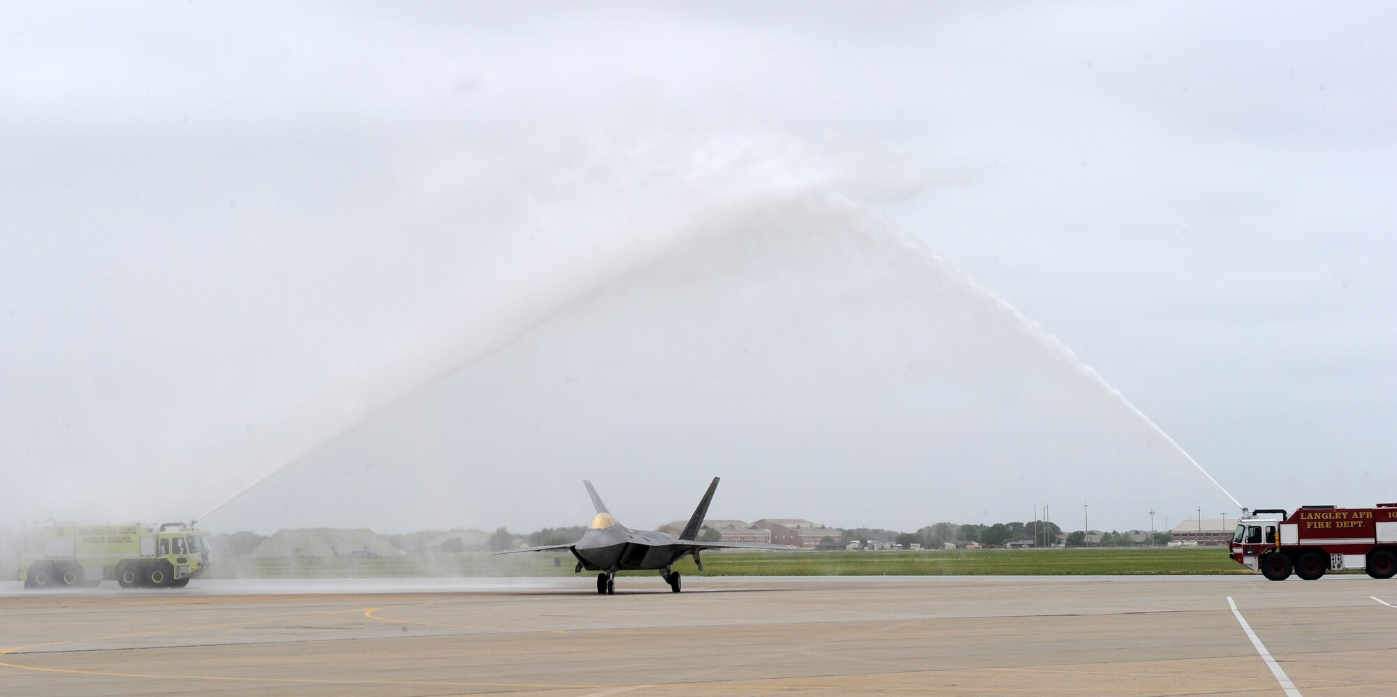 LANGLEY AIR FORCE BASE, Va. -- Col. Jeffrey W. Prichard, 1st Fighter Wing vice commander, is hosed down while returning from his final flight in the F-22A Raptor April 29.  This was Colonel Prichard's final flight as vice commander of the 1st Fighter Wing before deploying to Iraq.  (U.S. Air Fore photo/Airman 1st Class Zachary Wolf)

