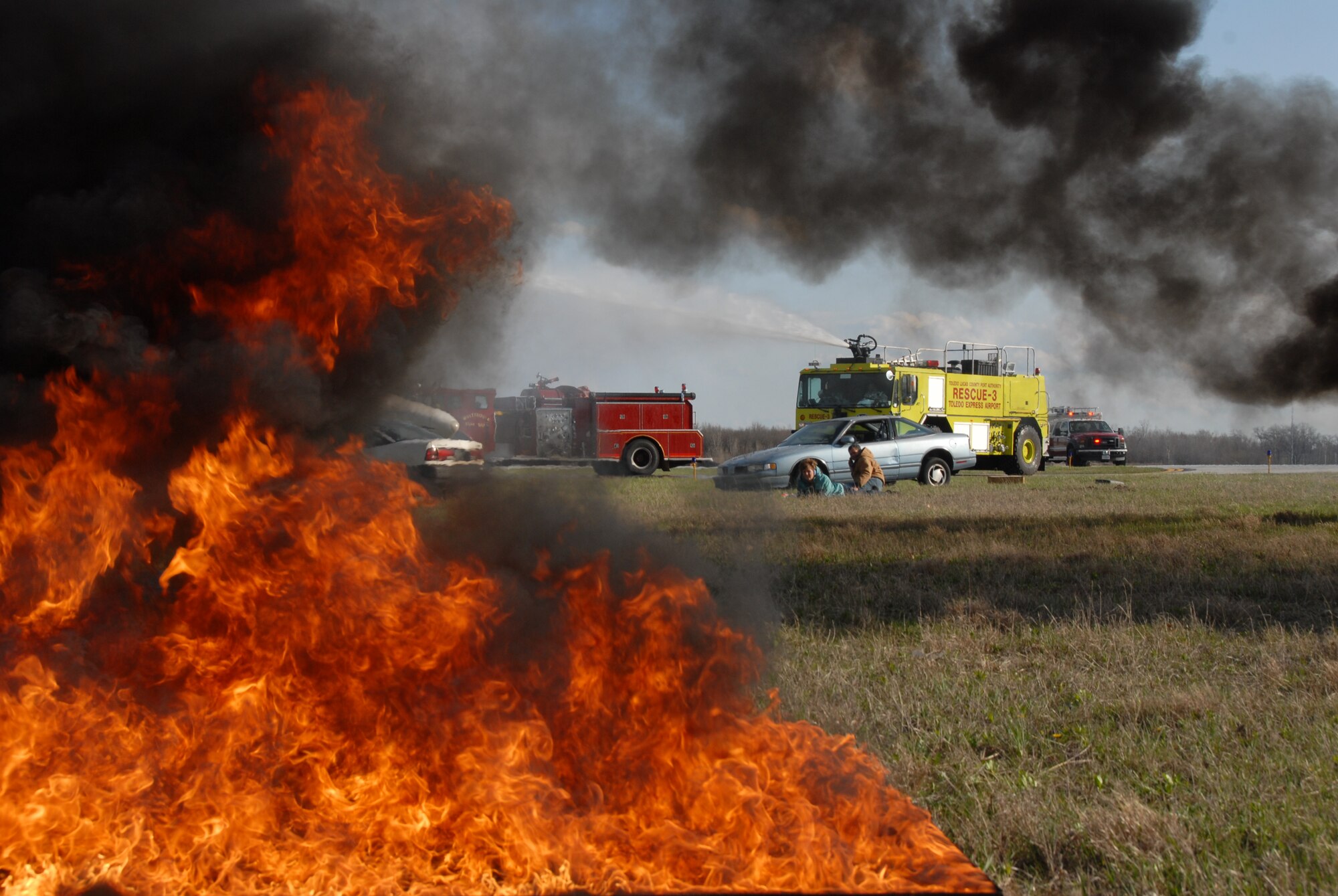 Members of the 180th Fighter Wing fire department participated in an aircraft crash and recovery exercise at the Toledo Express Airport on April 22. The drill, required every three years, not only tests the response of airport authorities, but also the response of other local emergency, fire and rescue crews that would normally respond to such an incident, to include the 180th FW fire department.  (Air Force photo taken by SrA Jodi Leininger, released by TSgt Beth Holliker.)