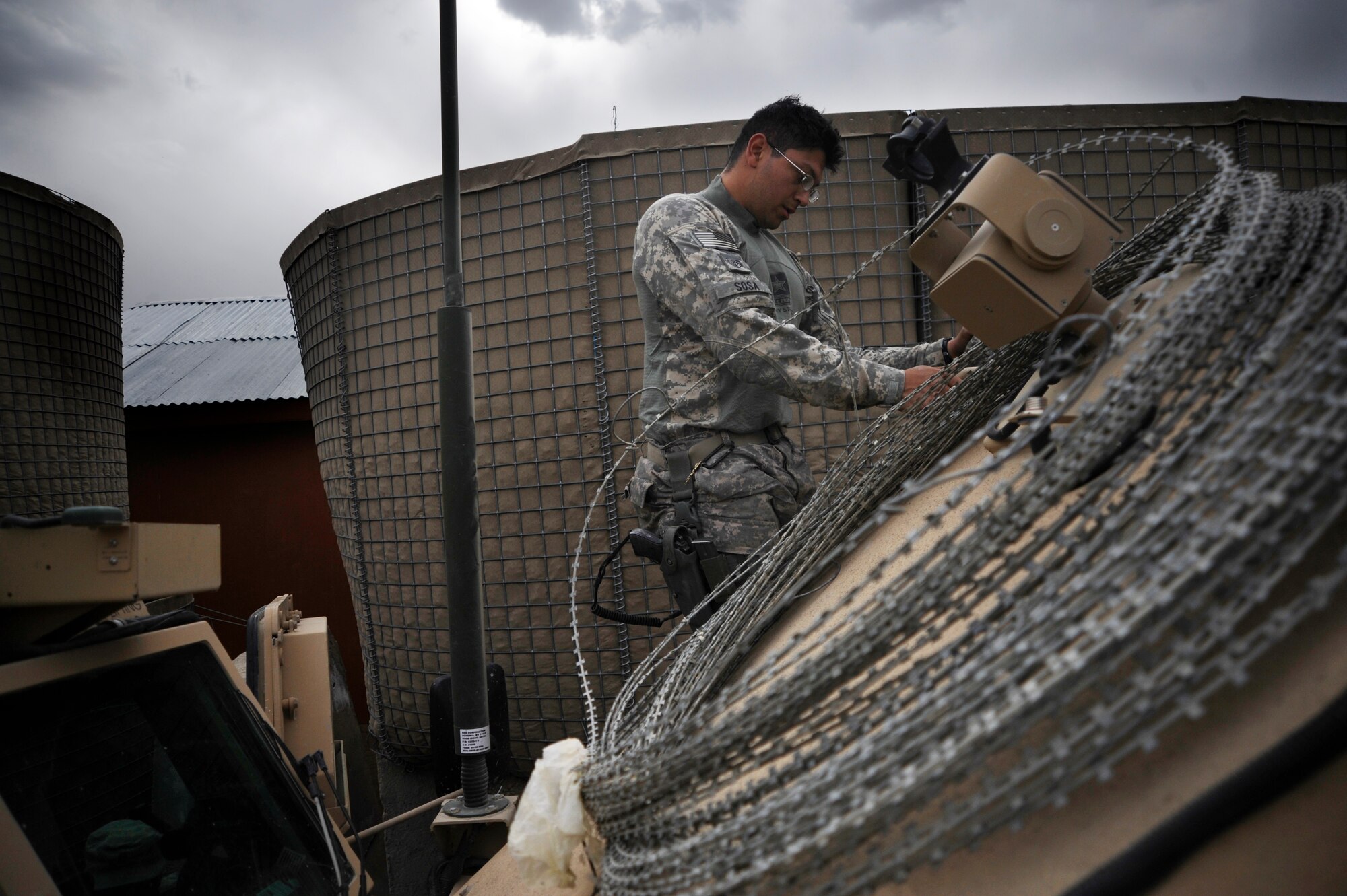 U.S. Air Force Staff Sgt. Nester Sosa a vehicle maintainer assigned to the Provincial Reconstruction Team, Forward Operating Base Gardez, Afghanistan, inspects a Medium Tactical Vehicle after combat operations, FOB Herrara, Afghanistan, April 20, 2009. Staff Sgt. Sosa is deployed from the 97th Logistics Readiness Squadron, Altus Air Base, Okla. (U.S. Air Force photo by Staff Sgt. Shawn Weismiller)
