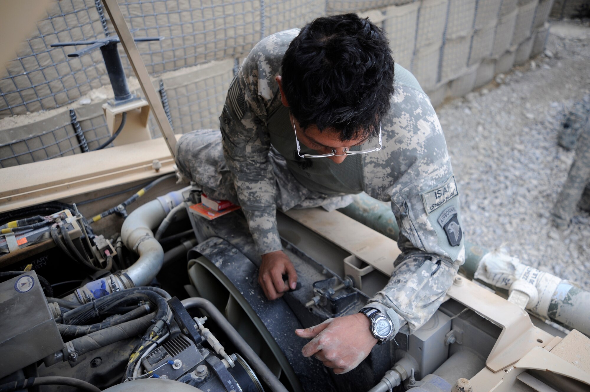 U.S. Air Force Staff Sgt. Nester Sosa a vehicle maintainer assigned to the Provincial Reconstruction Team, Forward Operating Base Gardez, Afghanistan, inspects a Medium Tactical Vehicle after combat operations, FOB Herrara, Afghanistan, April 20, 2009. Staff Sgt. Sosa is deployed from the 97th Logistics Readiness Squadron, Altus Air Base, Okla. (U.S. Air Force photo by Staff Sgt. Shawn Weismiller)