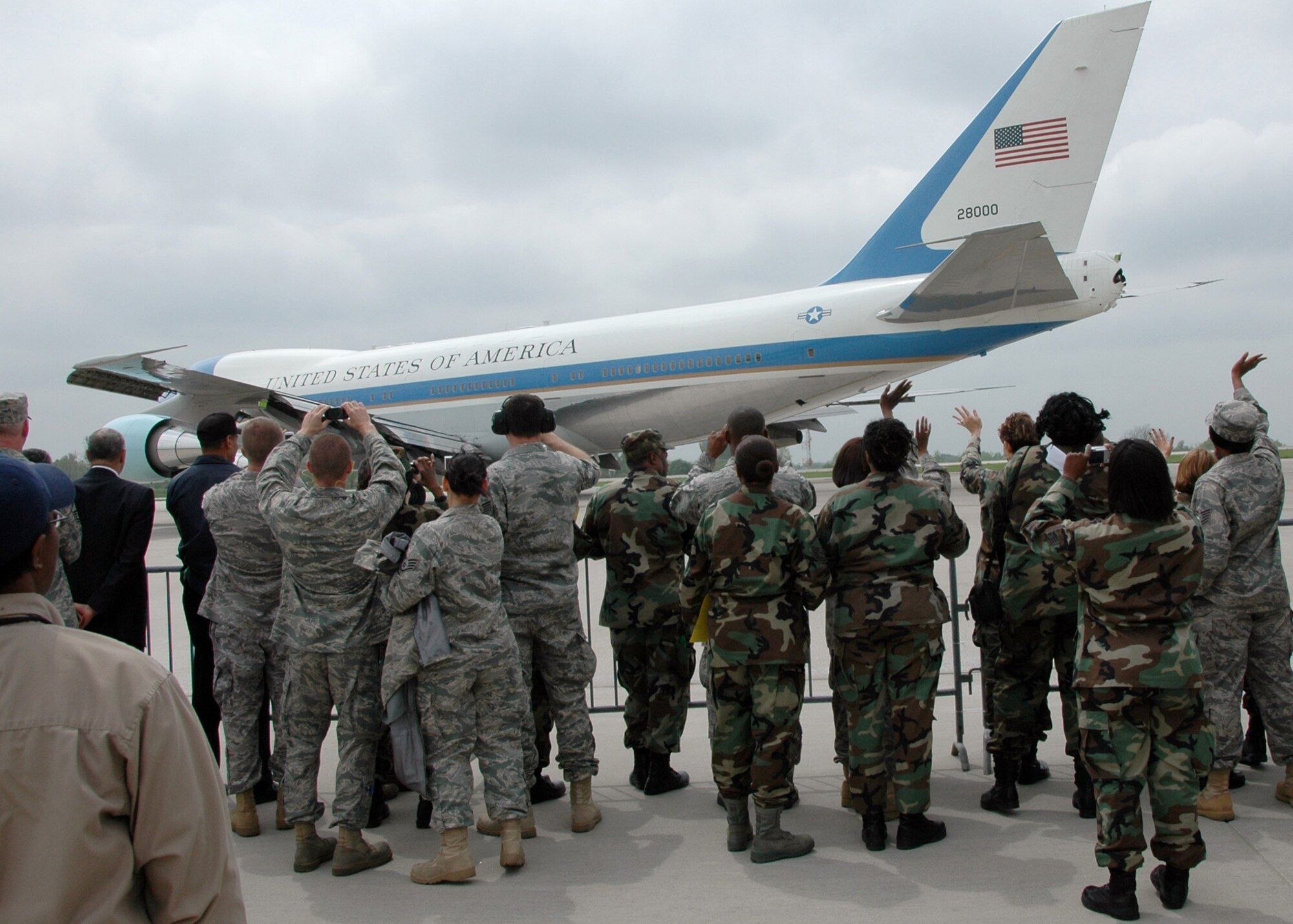 Members of the 131st Fighter Wing, Missouri Air National Guard wave as President Barack Obama takes off in Air Force One at Lambert-Saint Louis International Airport on April 29.  President Obama marked his 100th day in office with a Town Hall Meeting in Arnold, a surburb of Saint Louis, earlier that day. (U.S. Air Force Photo by Master Sergeant Mary-Dale Amison)  (RELEASED)