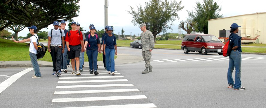 U.S. Air Force Master Sgt. Jason Lamoureux, a prior Military Training Instructor currently with the 733rd Air Mobility Squadron, gives marching training to recruits in the Delayed Enlistment Program during a "shake-down" as part of the "Day at BMT" program April 25 at Kadena Air Base, Japan. The program was started to help prepare new recruits for Basic Military Training.
(U.S. Air Force photo/Staff Sgt. Angelique Perez)
