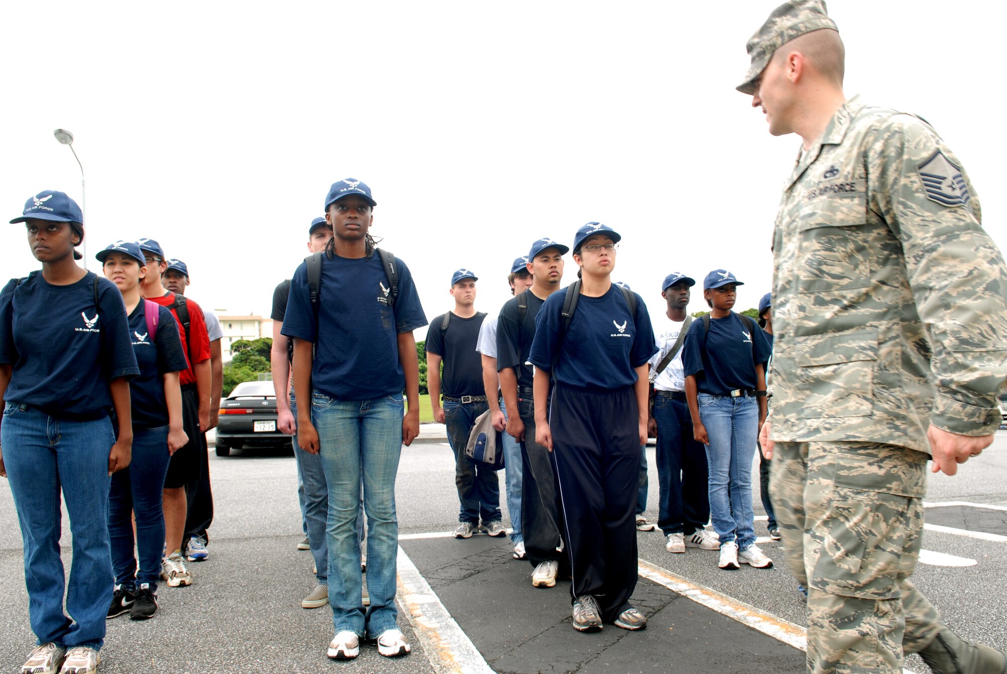 U.S. Air Force Master Sgt. Jason Lamoureux, a prior Military Training Instructor currently with the 733rd Air Mobility Squadron, gives marching training to recruits in the Delayed Enlistment Program during a "shake-down" as part of the "Day at BMT" program April 25 at Kadena Air Base, Japan. The program was started to help prepare new recruits for Basic Military Training.
(U.S. Air Force photo/Staff Sgt. Angelique Perez)