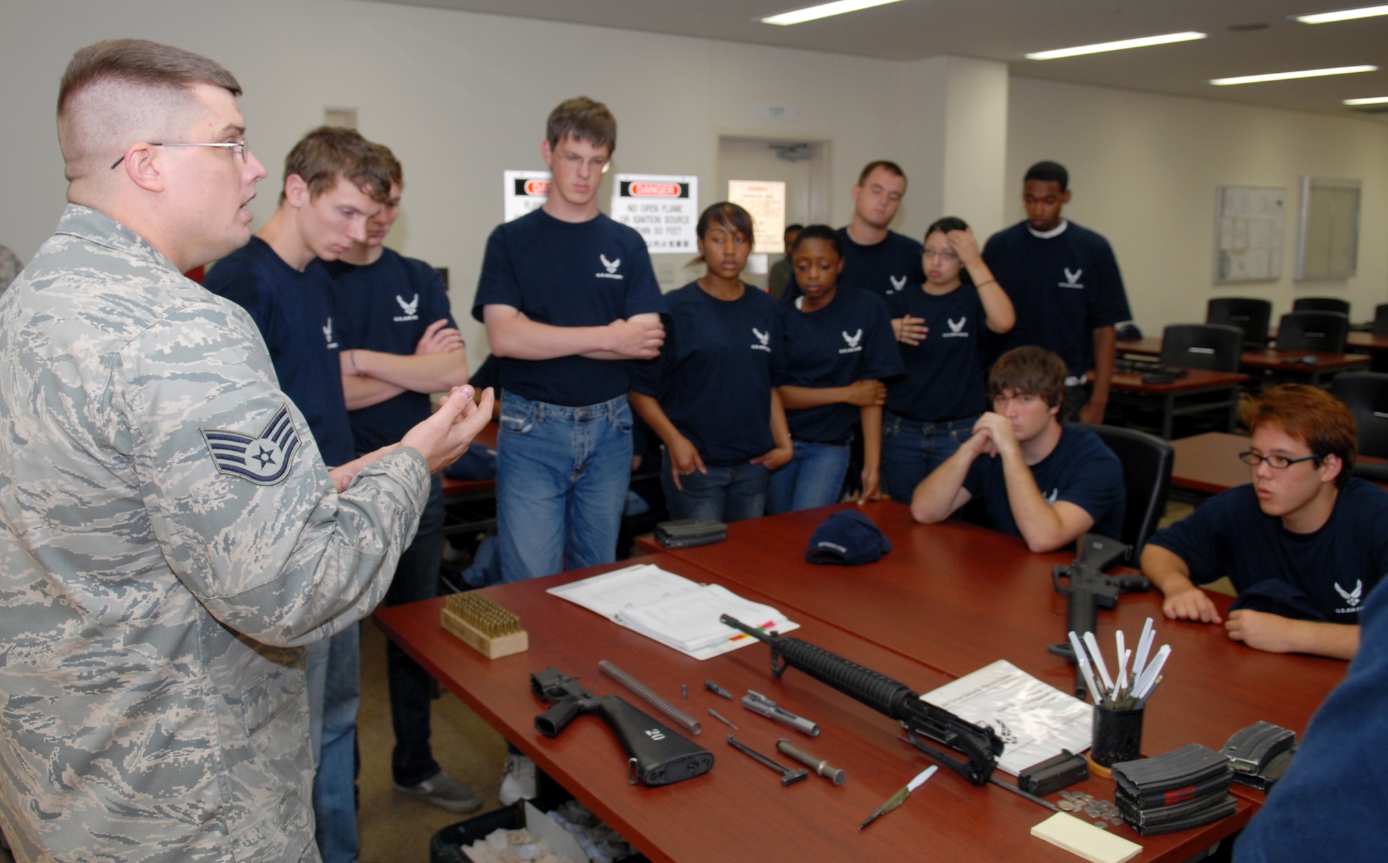 U.S. Air Force Staff Sgt. James Kipp, from the 18th Security Forces Squadron gives new recruits in the Delayed Enlistment Program M-16 familiarization training as part of the "Day at BMT" program April 25 at Kadena Air Base, Japan. The program was started to help prepare new recruits for Basic Military Training.
(U.S. Air Force photo/Staff Sgt. Angelique Perez)