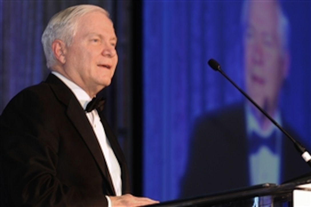 Defense Secretary Robert M. Gates introduces George H.W. Bush, the 41st president of the United States, who was being honored with the 2009 Atlantic Councils Distinguished International Leadership Award for his historic roles in helping to end the Cold War and reunify Germany. The ceremony was held April 29, 2009, in Washington, D.C.