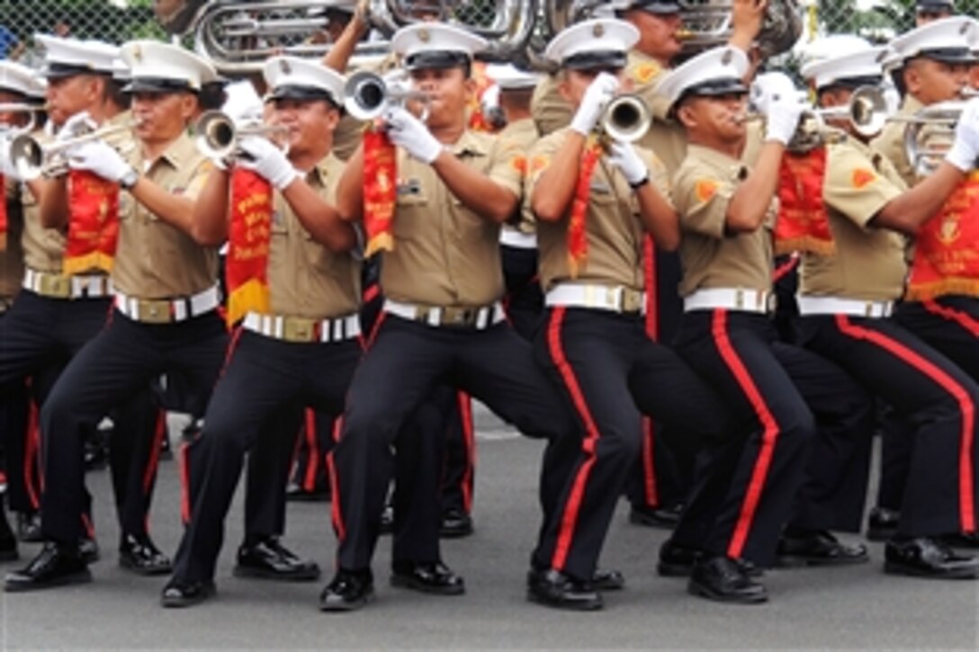 The Philippine Marine Drum and Bugle Corps performs during a community relations project in support of Balikatan 2009 on Fort Bonifacio, Taguig, Philippines, April 29, 2009. Balikatan is a bilateral exercise between the Philippine and U.S. militaries to maintain readiness and sustain the long-term security assistance relationship between the countries.