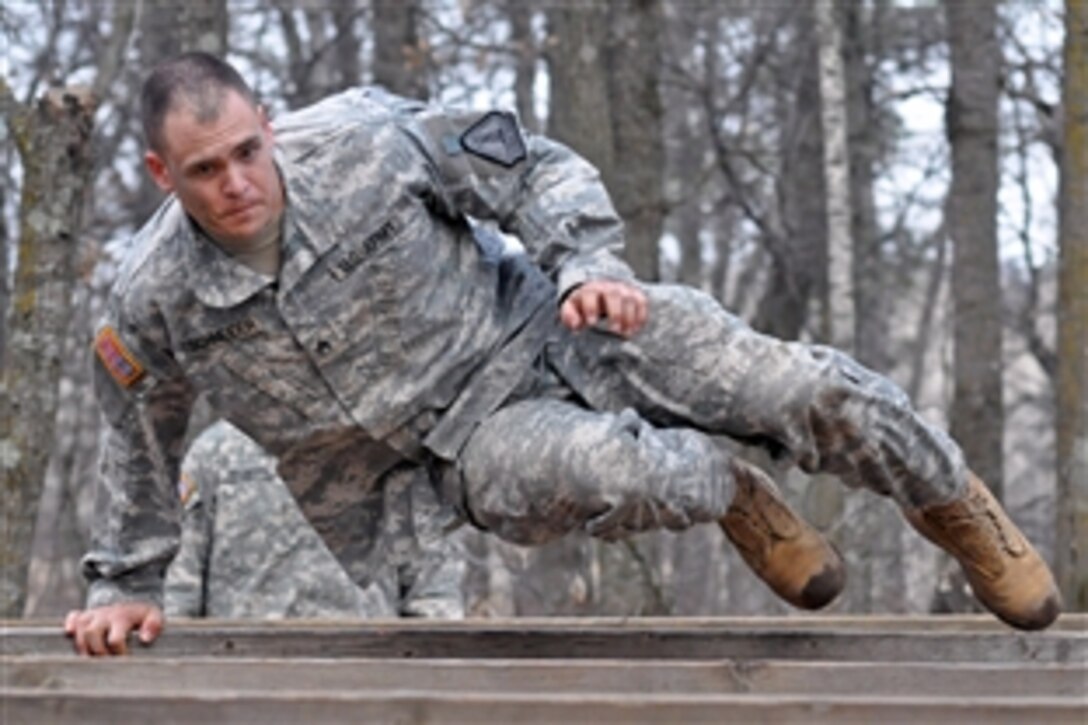 U.S. Army Staff Sgt. Joshua Schneider navigates the obstacle course during the 2009 Minnesota Army National Guard Soldier and Non-Commissioned officer of the year competition held on Camp Ripley, Minn., April 17, 2009. Schneider is a recruiter assigned to the Recruiting and Retention Battalion.