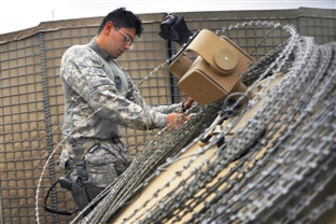 U.S. Air Force Staff Sgt. Nester Sosa inspects a medium tactical vehicle after combat operations on Forward Operating Base Herrara, Afghanistan, April 20, 2009. Sosa a vehicle maintainer assigned to the Provincial Reconstruction Team, Forward Operating Base Gardez, Afghanistan.