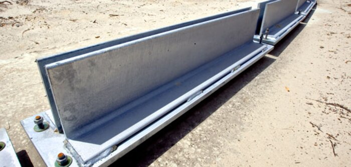 Marines with the technical rescue platoon at Chemical Biological Incident Response Force (CBIRF), II Marine Expeditionary Force, use a blow torch to cut through debris on top of a rubble pile, here, April 30. CBIRF hosted a civic leader tour here to show the leaders how the unit operates in a contaminated environment.