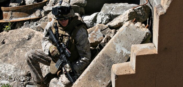 Lance Cpl. Deric King (left) and Lance Cpl. Julius Smoak, identification and detection specialists, Headquarters and Service Company, Chemical Biological Incident Response Force (CBIRF), II Marine Expeditionary Force, prepare samples from a simulated chemical lab April 30. The unit hosted a civic leader tour here to show how Marines operate in a contaminated area.