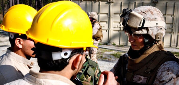 Sgt. Corey Trott, extractor, company A, Chemical Biological Incident Response Force (CBIRF), II Marine Expeditionary Force, navigates his way though a confined space trainer to simulate how CBIRF Marines and sailors navigate through collapsed structures using a right-handed search pattern, here,  April 30. The unit hosted a civic leader tour, and while the leaders got to see how CBIRF Marines and sailors navigate through a collapsed structures and to show how Marines operate in a contaminated area.