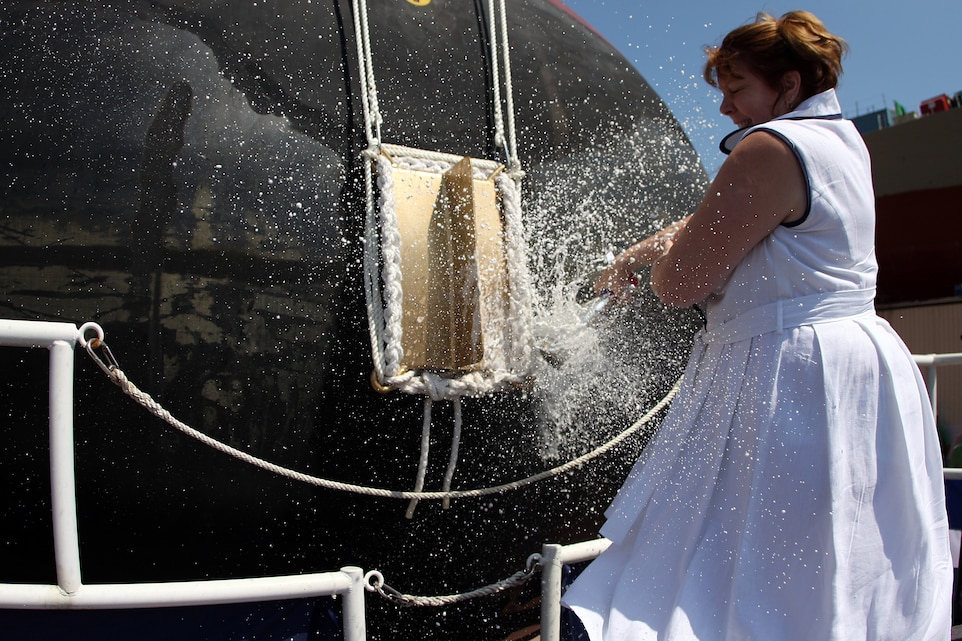 Deb Dunham christens the Arleigh Burke-class guided-missile destroyer Jason Dunham (DDG 109) at General Dynamics Bath Iron Works in Bath, Maine. The ship is named for her son, U.S. Marine Cpl. Jason Dunham, who was posthumously awarded the Medal of Honor for his actions in Operation Iraqi Freedom.