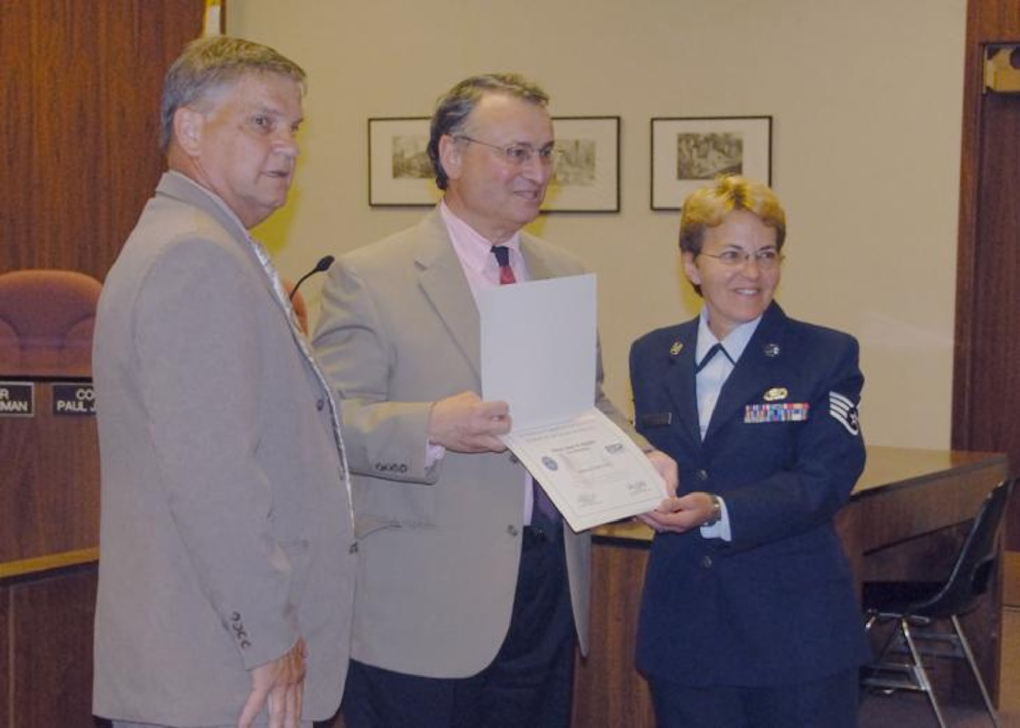 Mr. Earl Bonnet (L), Mayor Ruberto (C) and Staff Sgt. Rosanne Frieri (R)  pose for a photo at Pittsfield City Hall on 16 July.