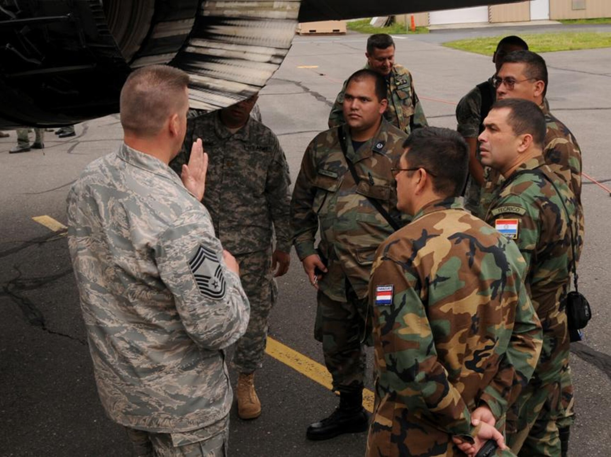 Chief Master Sgt. Galen Wilson gives the Paraguayan maintainers a tour of the F-15  during their engagement June 16th