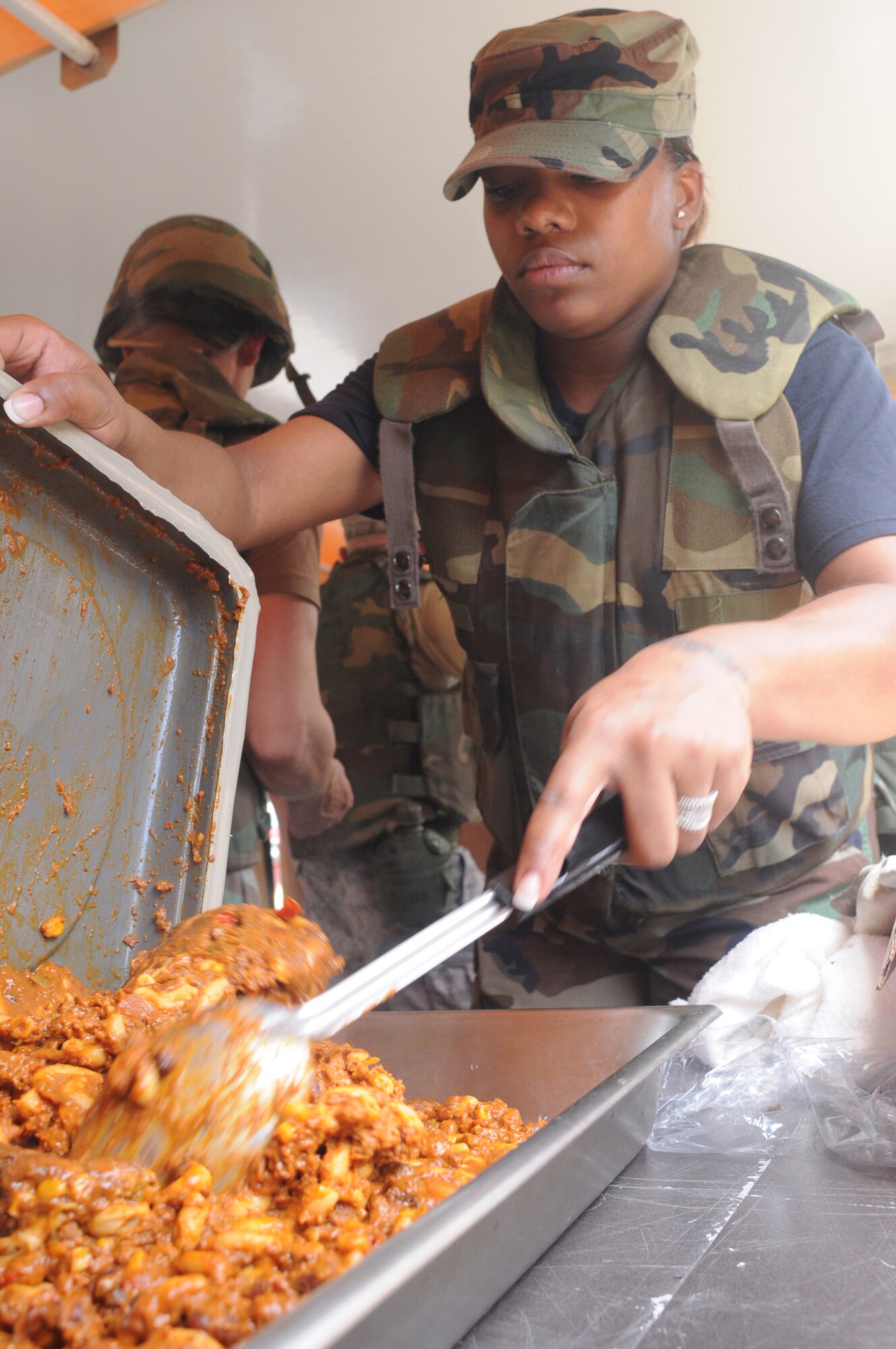 Staff Sgt. Vilynthia Hawkins, 86th Services Squadron, Ramstein Air Base, Germany, prepares a chili macaroni hot lunch while participating in a week long contingency exercise Silver Flag. There are nine to ten Silver Flag exercises held throughout the year at the 86th Construction Training Squadron, Ramstein Air Base, Germany, and the average class size is 100 to 200 people. (U.S. Air Force photo by: Tech. Sgt. Sean Mateo White)