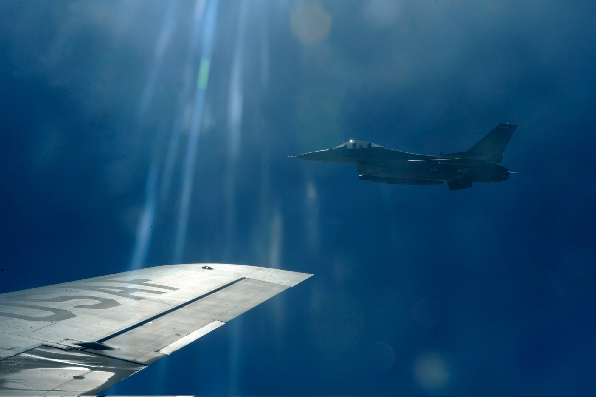 An Air Force F-16CJ Fighting Falcon departs a KC-135 Stratotanker from the 340th Expeditionary Air Refueling Squadron after refueling over Iraq, July 28, in support of Operation Iraqi Freedom. The KC-135 Stratotanker provides the core aerial refueling capability for the United States Air Force and has excelled in this role for more than 50 years. (U.S. Air Force photo/Staff Sgt. Michael B. Keller)
