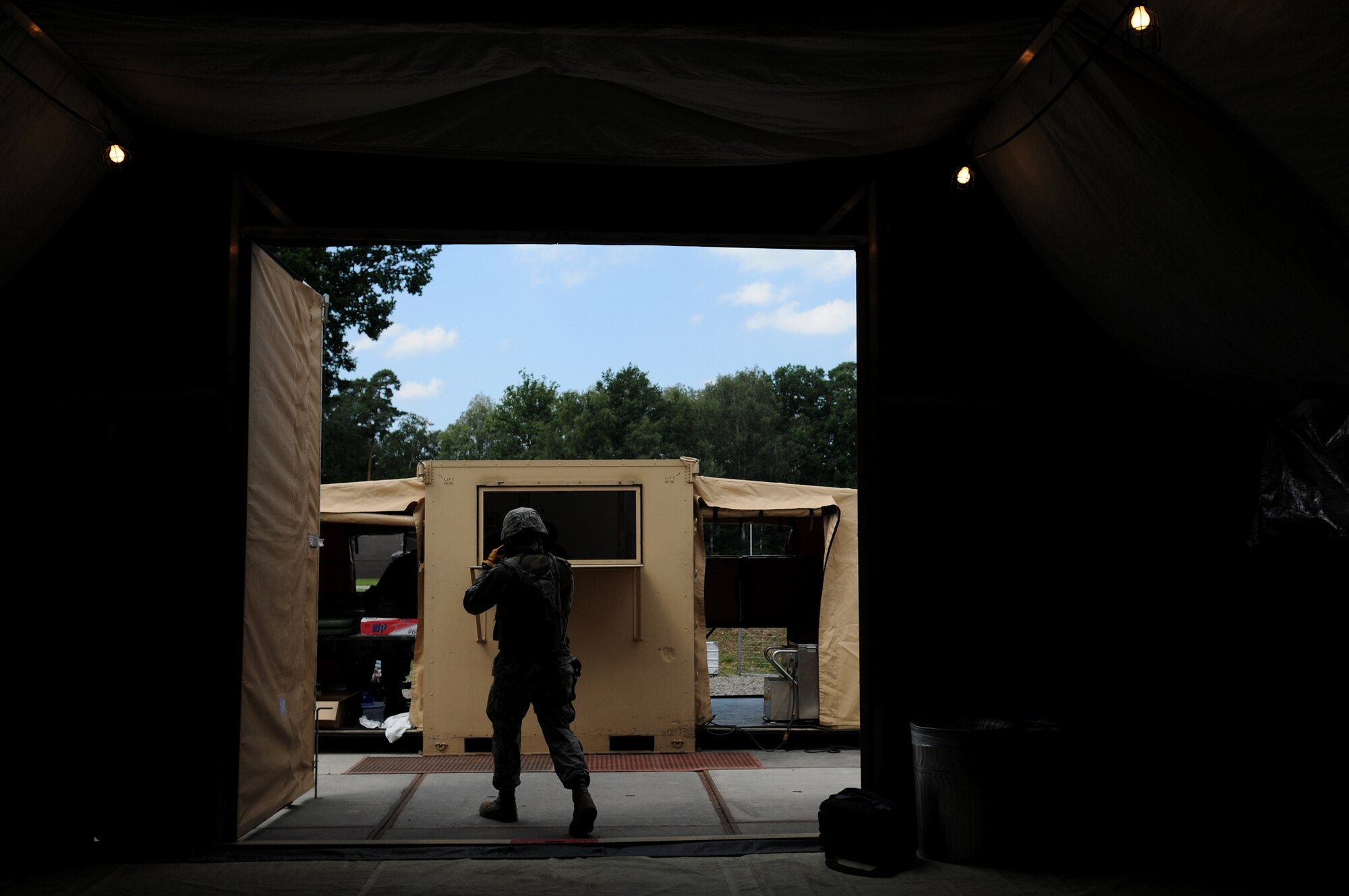 U.S. Air Force 1st Lt. Thomas Lanigan, 86th Airlift Wing Services Squadron operations officer, heads out the tent after eating chow to continue the mission exercise during the Silver Flag exercise on Ramstein Air Base, Germany, Aug. 1, 2009. The Silver Flag exercise gives participants the basic contingency skills to set up a bed down operation anywhere in the world. (U.S. Air Force photo by Airman 1st Class Grovert Fuentes-Contreras)(Released)