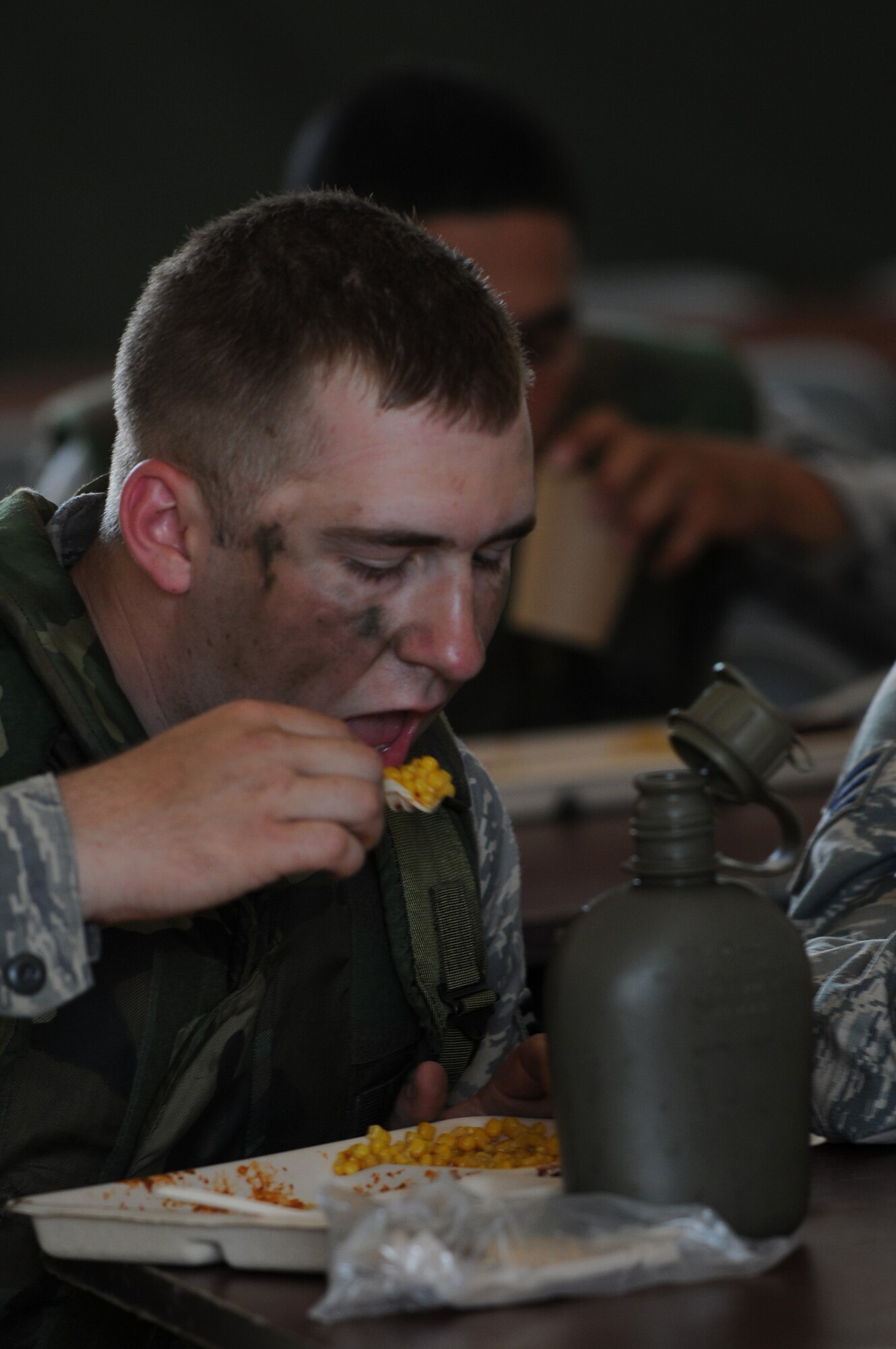 U.S. Air Force Airman 1st Class David Overstreet, 786th Civil Engineer Squadron, eats chow during the Silver Flag exercise on Ramstein Air Base, Germany, Aug. 1, 2009. Members throughout United States Air Forces in Europe participated in the mandated seven day training for civil engineers, services, logistics, medical and personnelists. (U.S. Air Force photo by Airman 1st Class Grovert Fuentes-Contreras)(Released)