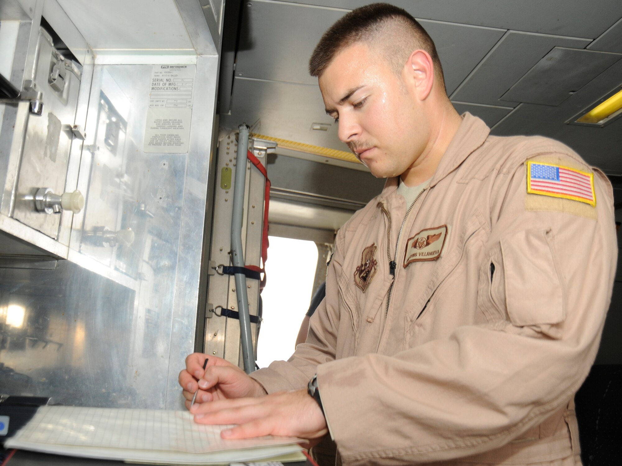 SOUTHWEST ASIA – Staff Sgt. Chris Villanueva, 908th Expeditionary Air Refueling Squadron, does pre-flight calculations before a combat mission July 28. Sergeant Villanueva recently passed the 100 combat mission milestone. He is deployed from McGuire AFB, N.J., and hails from Moreno Valley, Calif.(U.S. Air Force photo/Senior Airman Stephen Linch)