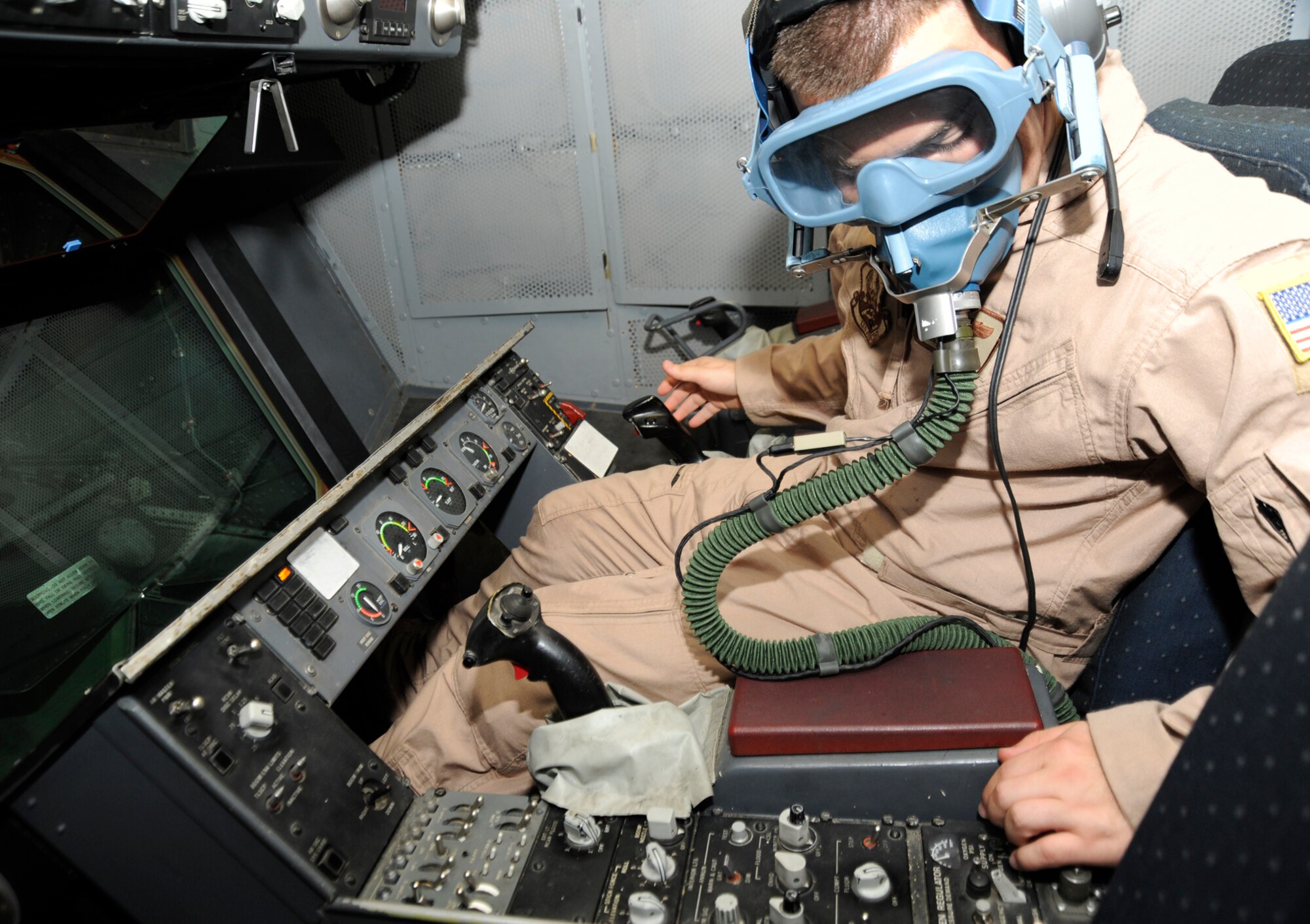 SOUTHWEST ASIA – Staff Sgt. Chris Villanueva, 908th Expeditionary Air Refueling Squadron, does pre-flight checks before a combat mission July 28. Sergeant Villanueva and his wife, Staff Sergeant Debbie Villanueva, 908th EARS, both recently passed the 100 combat missions milestone. (U.S. Air Force photo/Senior Airman Stephen Linch)