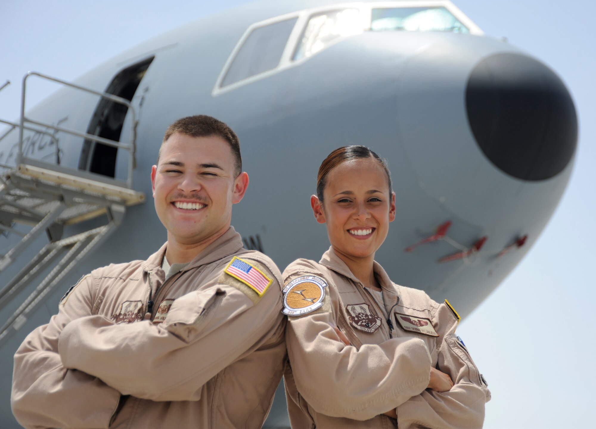 SOUTHWEST ASIA – Staff Sgt.’s Chris and Debbie Villanueva, 908th Expeditionary Air Refueling Squadron, pose for a photo July 28. The air-refueling couple recently passed the 100 combat missions milestone. They are deployed from McGuire AFB, N.J. (U.S. Air Force photo/Senior Airman Stephen Linch)