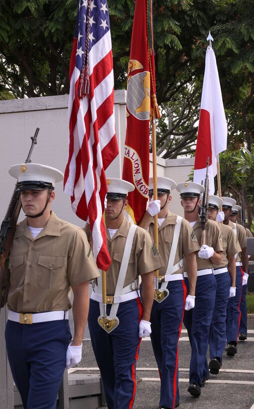 Headquarters and Service Battalion, Marine Corps Base Hawaii color guard displays the Japanese and U.S. colors during a wreath laying ceremony at the National Memorial Cemetery of the Pacific where staff and students from the Hakubi Kiyoto Kimono Schools honored thousands of American heroes buried there Aug. 3. (Official U.S. Marine Corps photo by Cpl. Cristina Noelia Gil) (Released)