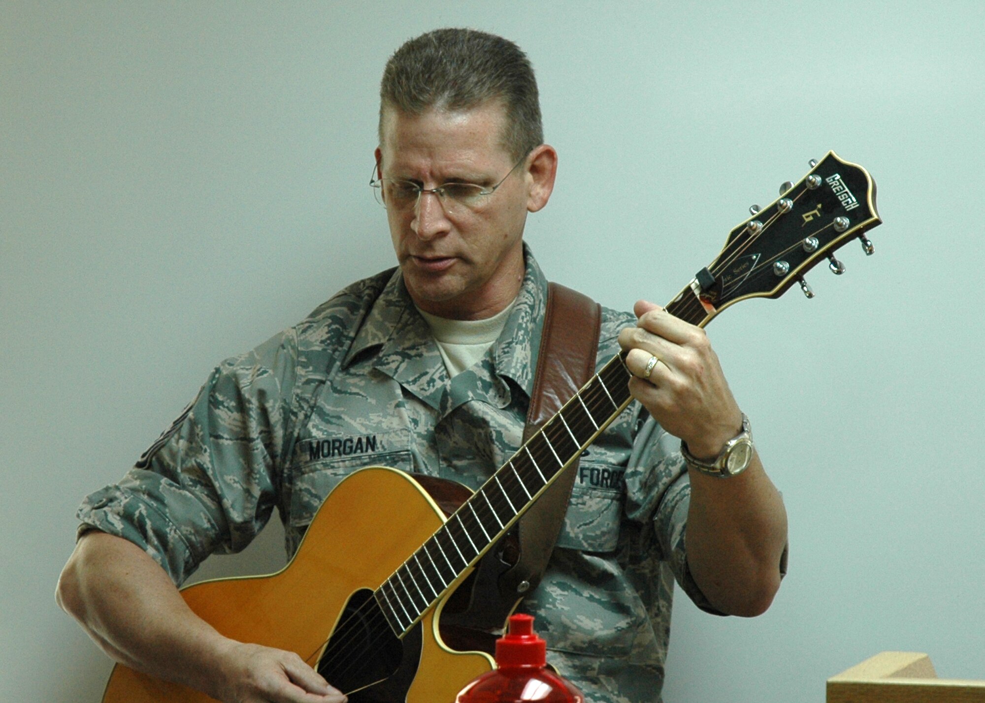 Master Sgt. Michael Morgan, 919th Special Operations Wing Staff first sergeant, leads chapel paritioners in song during the UTA Sunday Service at Duke Field Aug. 2. Protestant chapel services are held every UTA Sunday in building 3064 at 12:15 p.m.  (U.S. Air Force Photo/Staff Sgt. Jon McCallum)