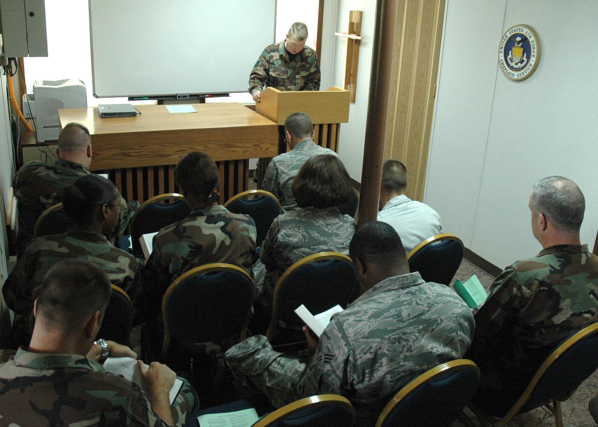 Reservists read a passage during Protestant service at the Chapel Aug. 2 at Duke Field. The message for the day was given by Staff Sgt. Eric Randall, 919th Special Operations Wing chaplain assistant. Protestant chapel services are held every UTA Sunday in building 3064 at 12:15 p.m. (U.S. Air Force Photo/Staff Sgt. Jon McCallum)